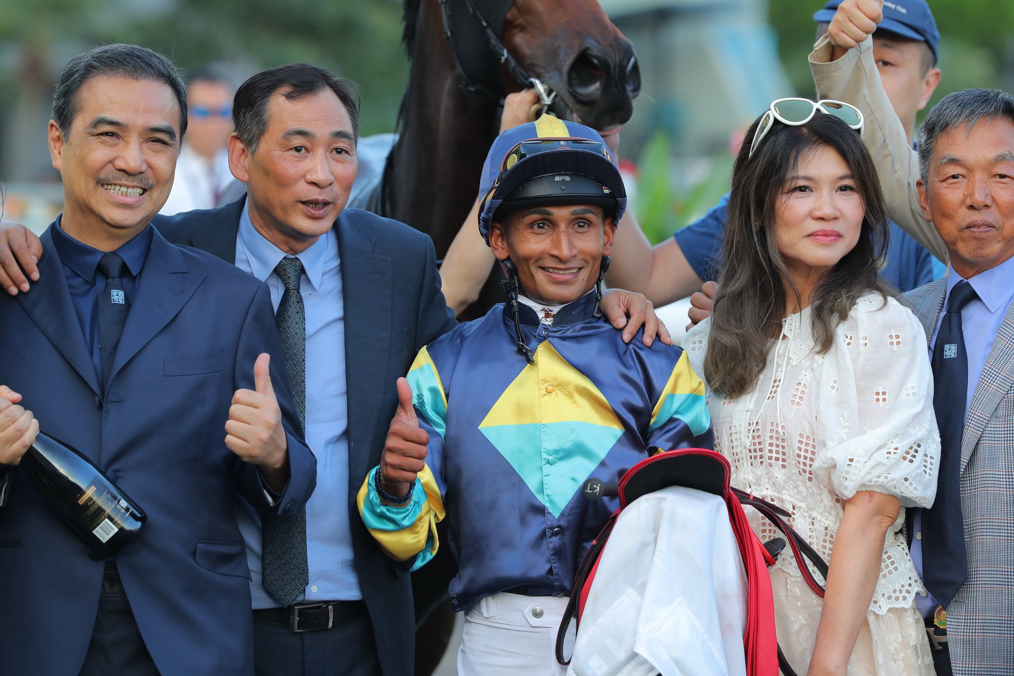 Trainer Michael Chang, jockey Karis Teetan and Lady's Choice connections celebrate his Sha Tin triumph.