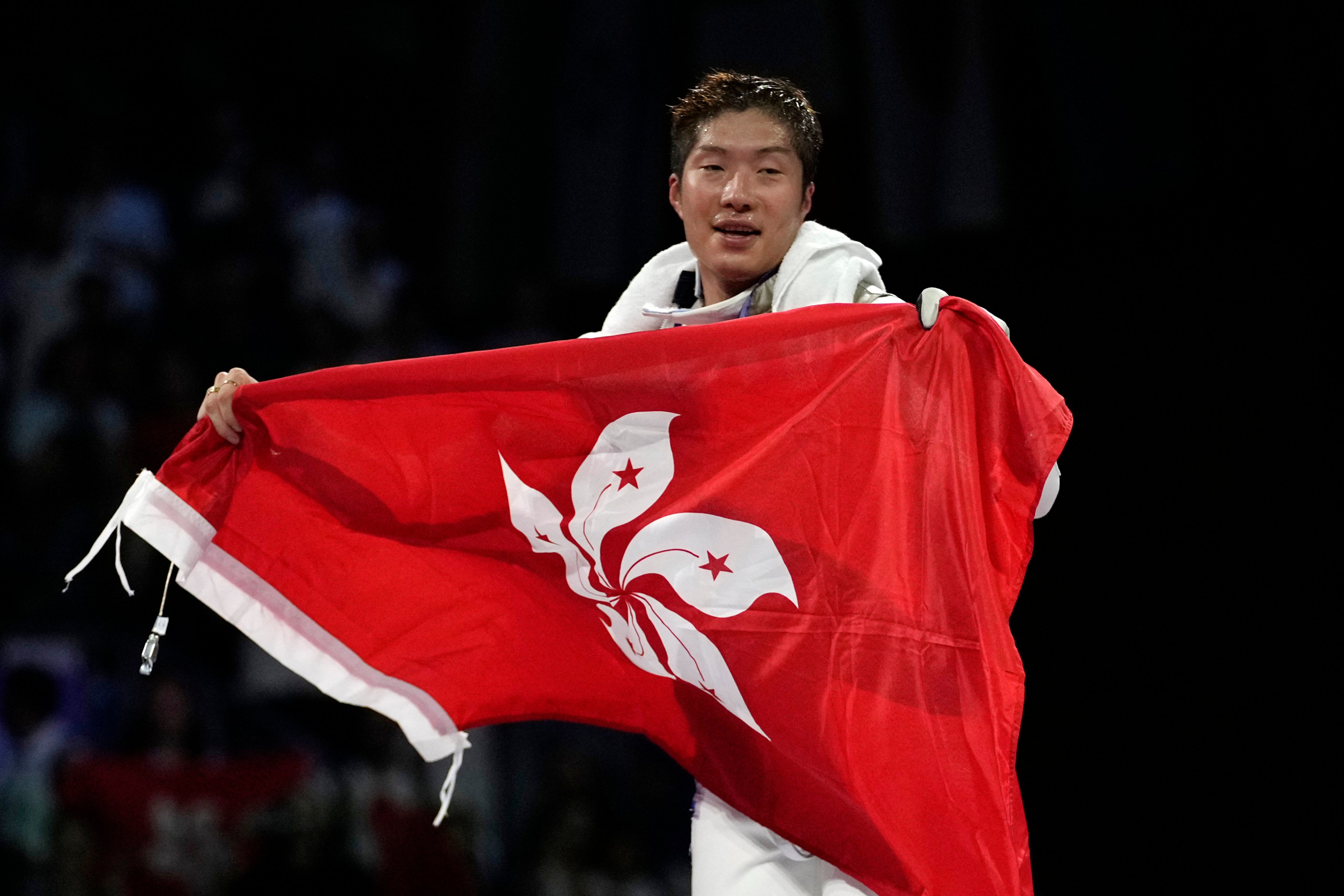 Cheung Ka-long celebrates after winning the men’s individual foil final against Italy’s Filippo Macchi in Paris in July. Photo: AP 