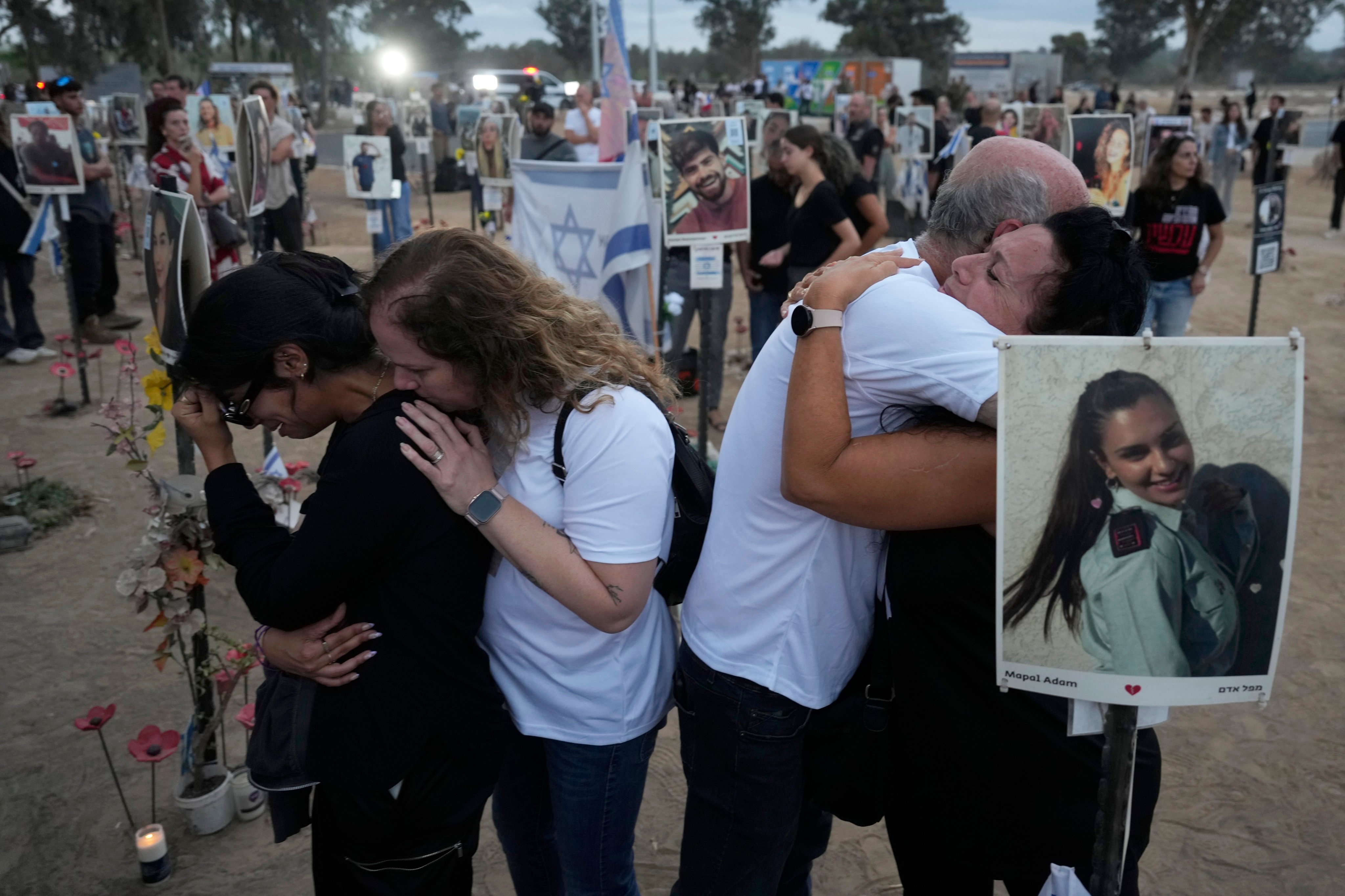 People at the site of the Nova music festival, where hundreds of revelers were killed and abducted by Hamas and taken into Gaza. Photo: AP