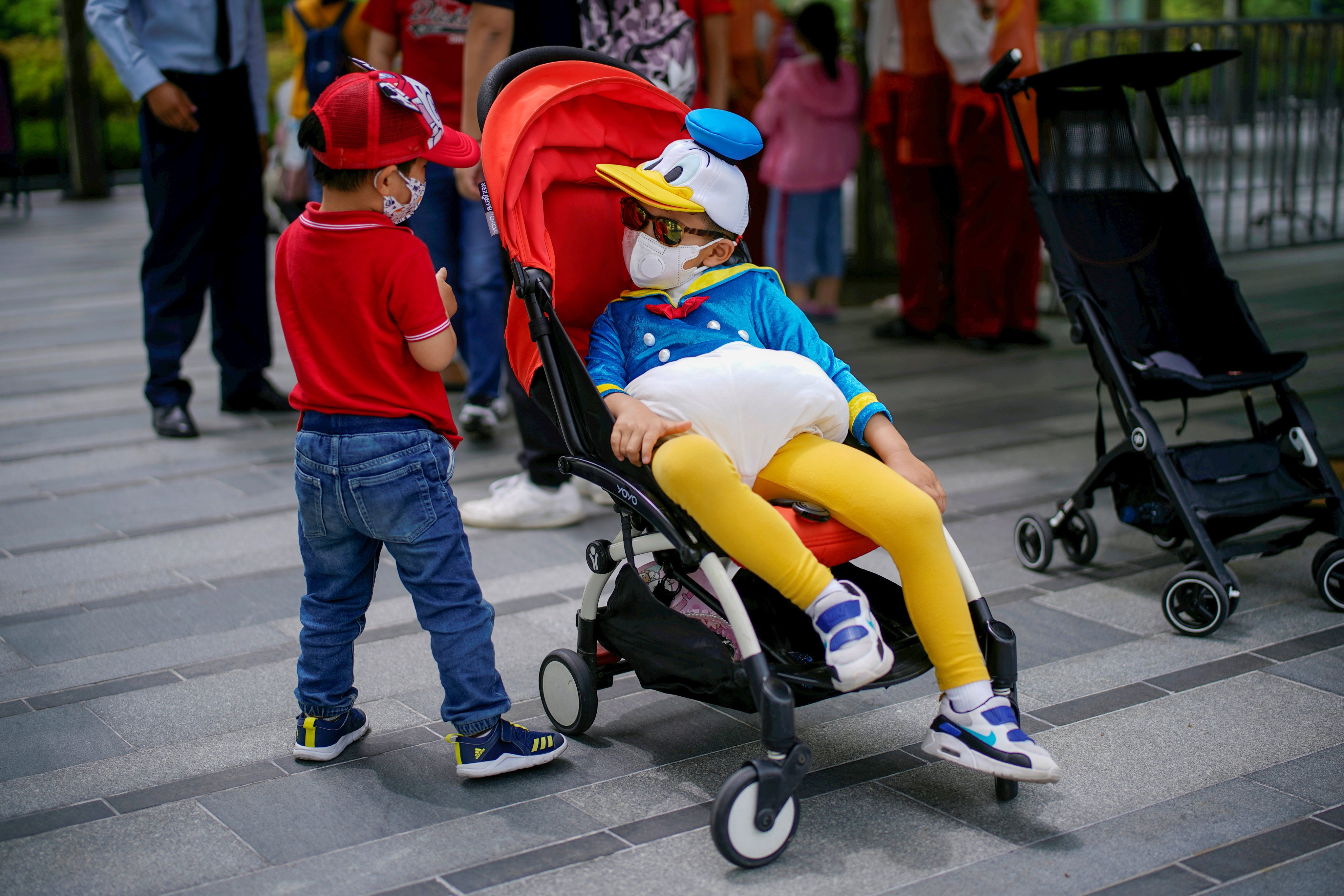 Children have a chat at Shanghai Disney Resort in 2020. Photo: Reuters 
