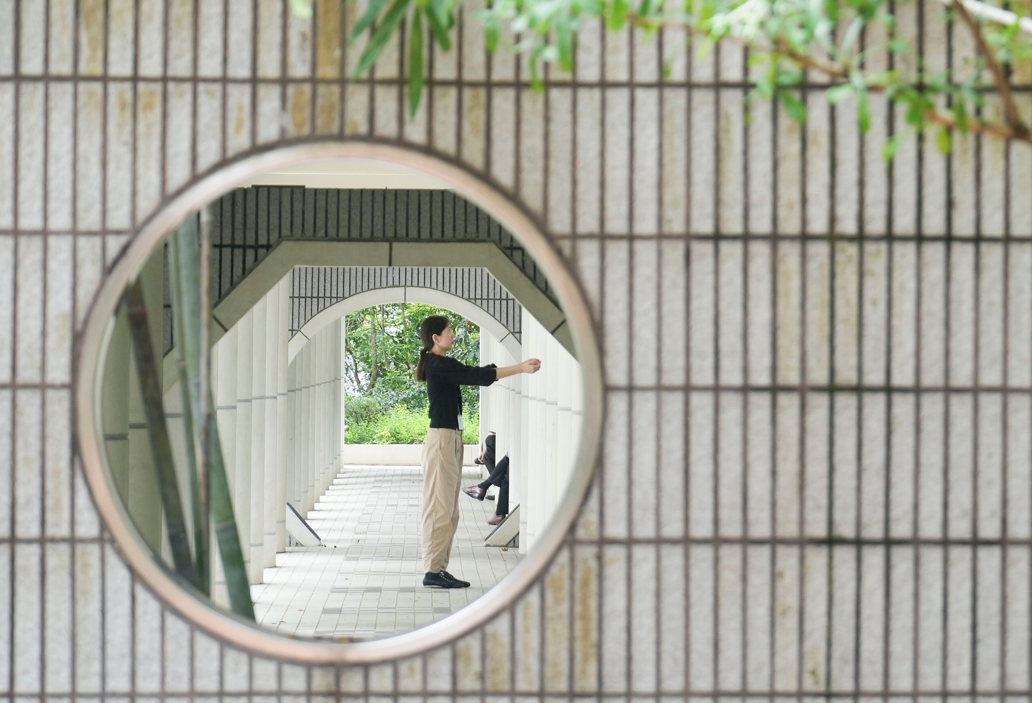 A woman exercises during lunch hour at Hong Kong Park, in Admiralty, on May 28. Poor working conditions limit time for physical activity and lead to a reliance on fast and processed food, increasing absenteeism and hurting productivity. Photo: Sam Tsang