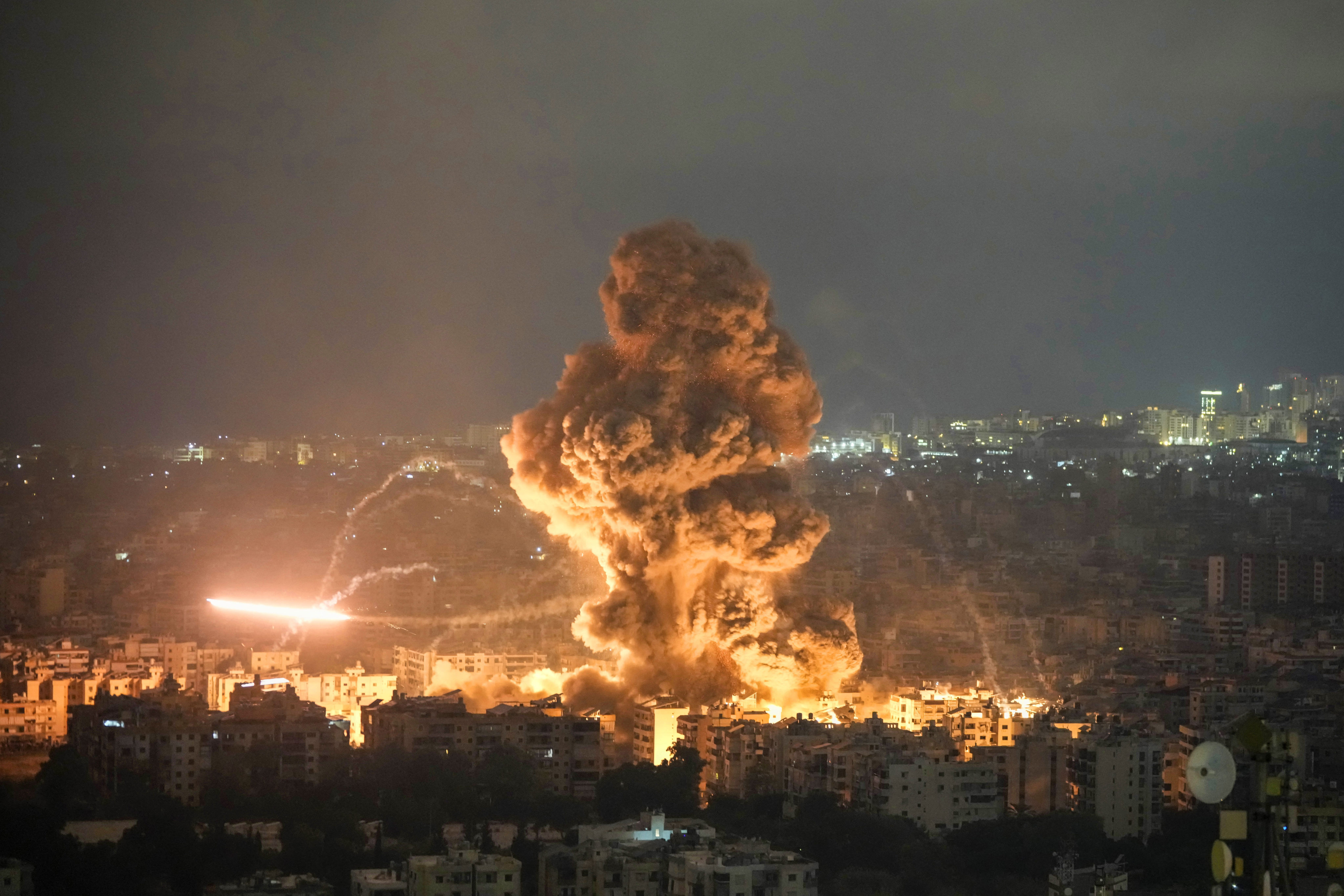 Flames and smoke rise from an Israeli strike in Dahiyeh, Beirut, Lebanon late on Sunday. Photo: AP
