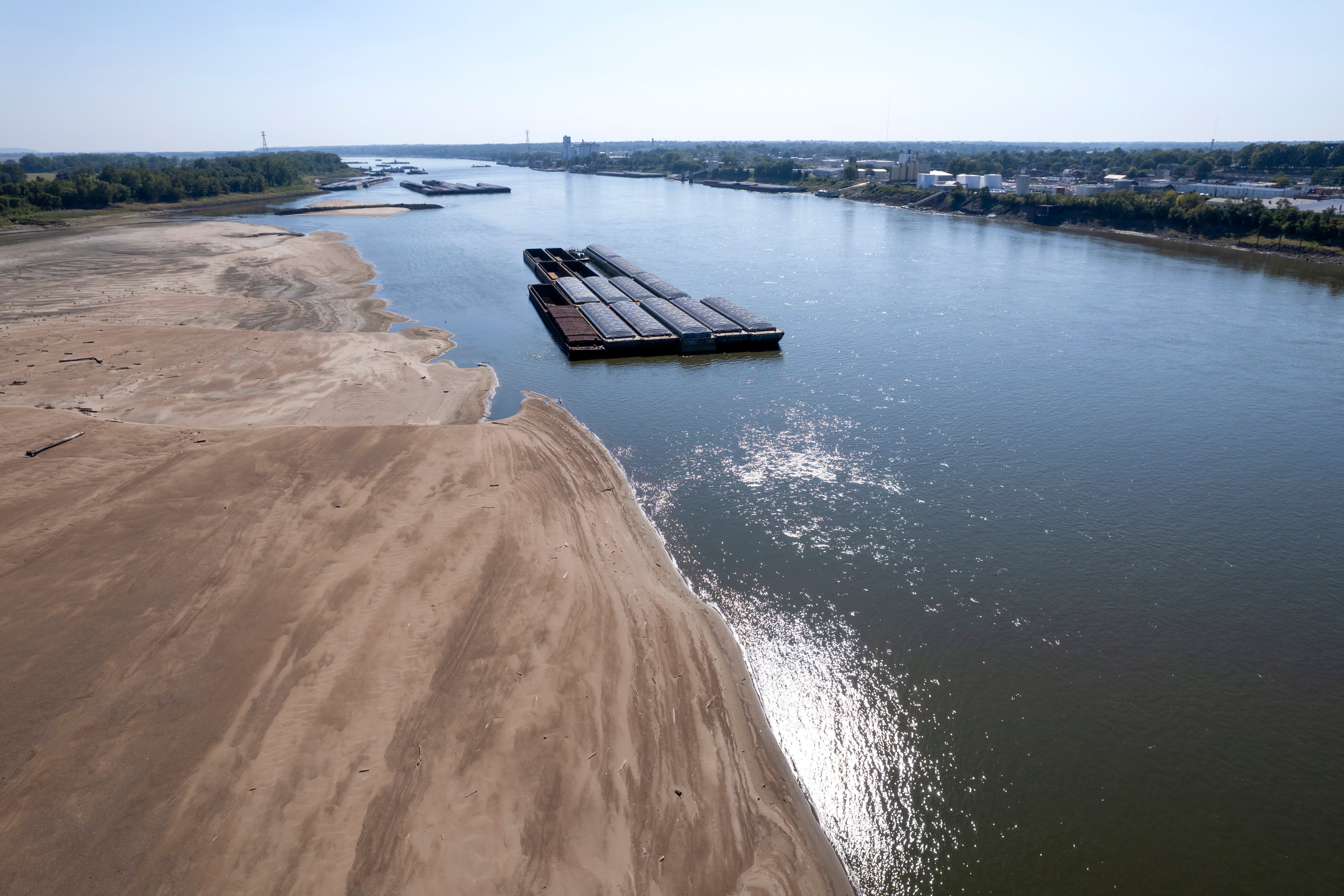 Barges float in the Mississippi River as a portion of the riverbed is exposed. Photo: AFP