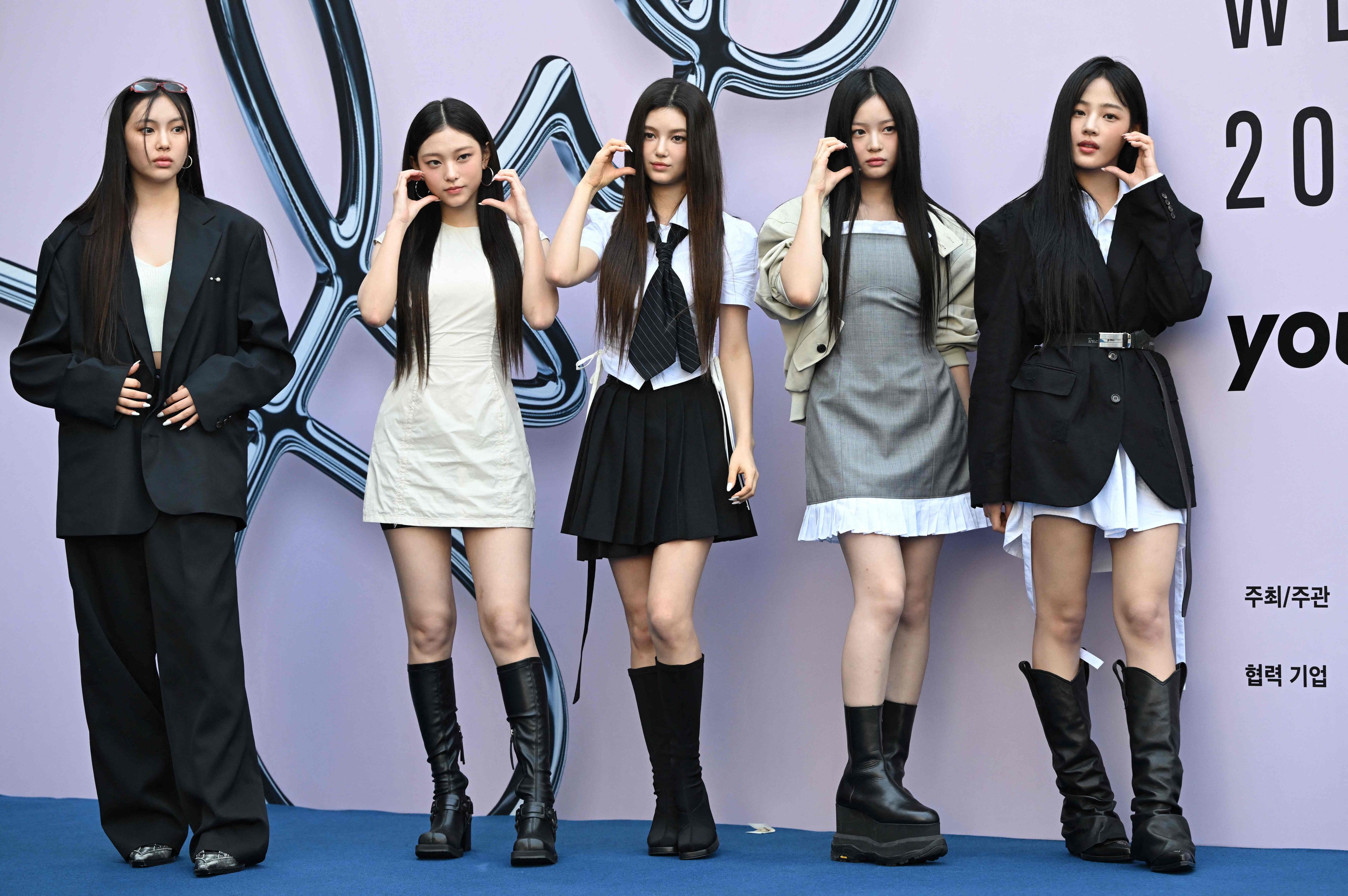 Members of K-pop girl group NewJeans pose on the blue carpet at the 2025 Spring/Summer Seoul Fashion Week in South Korea on September 3. Photo: AFP