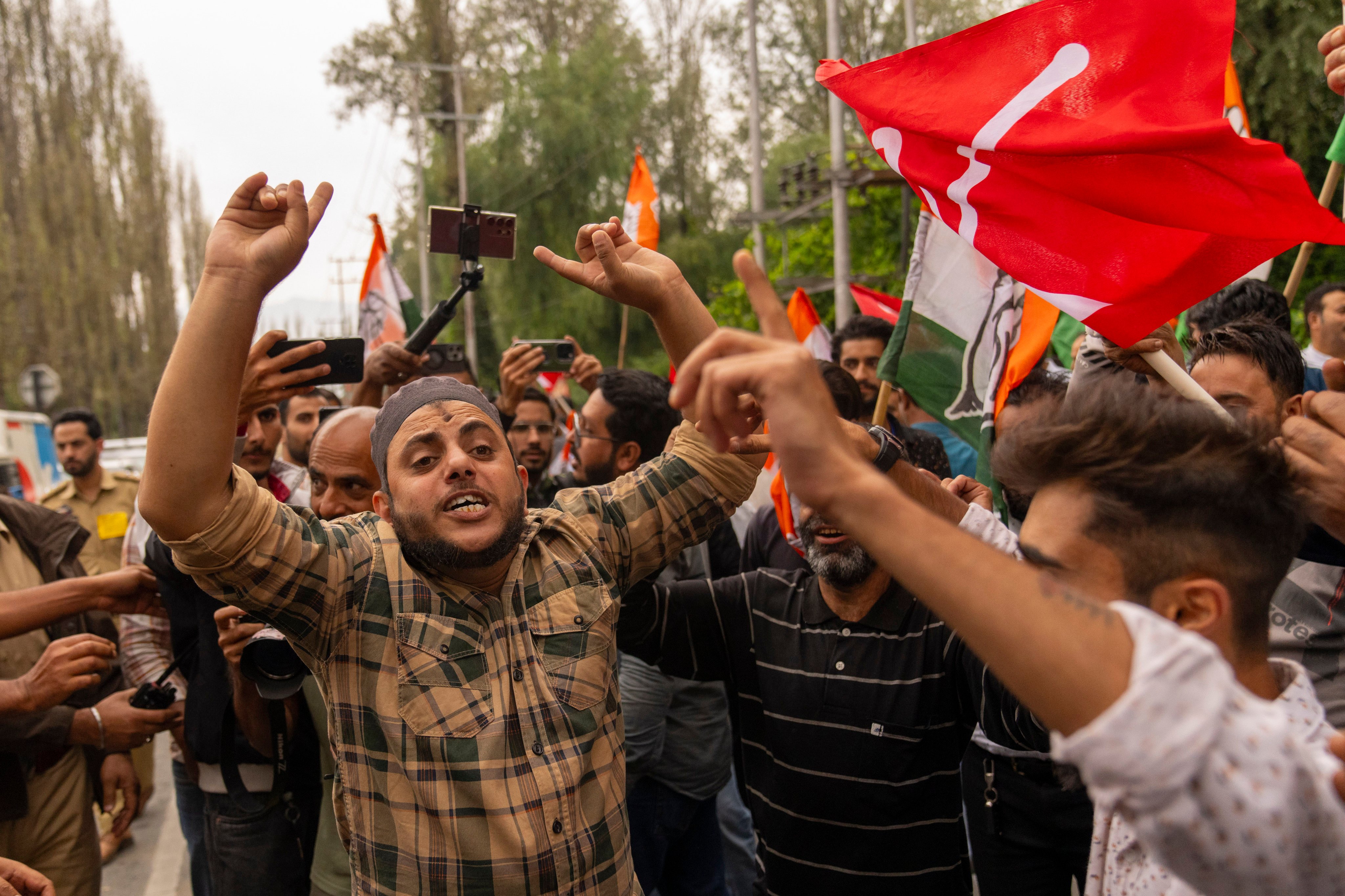 Supporters of National Conference party shout slogans as they celebrate early leads in the election for a local government in Indian controlled Kashmir on Tuesday. Photo: AP