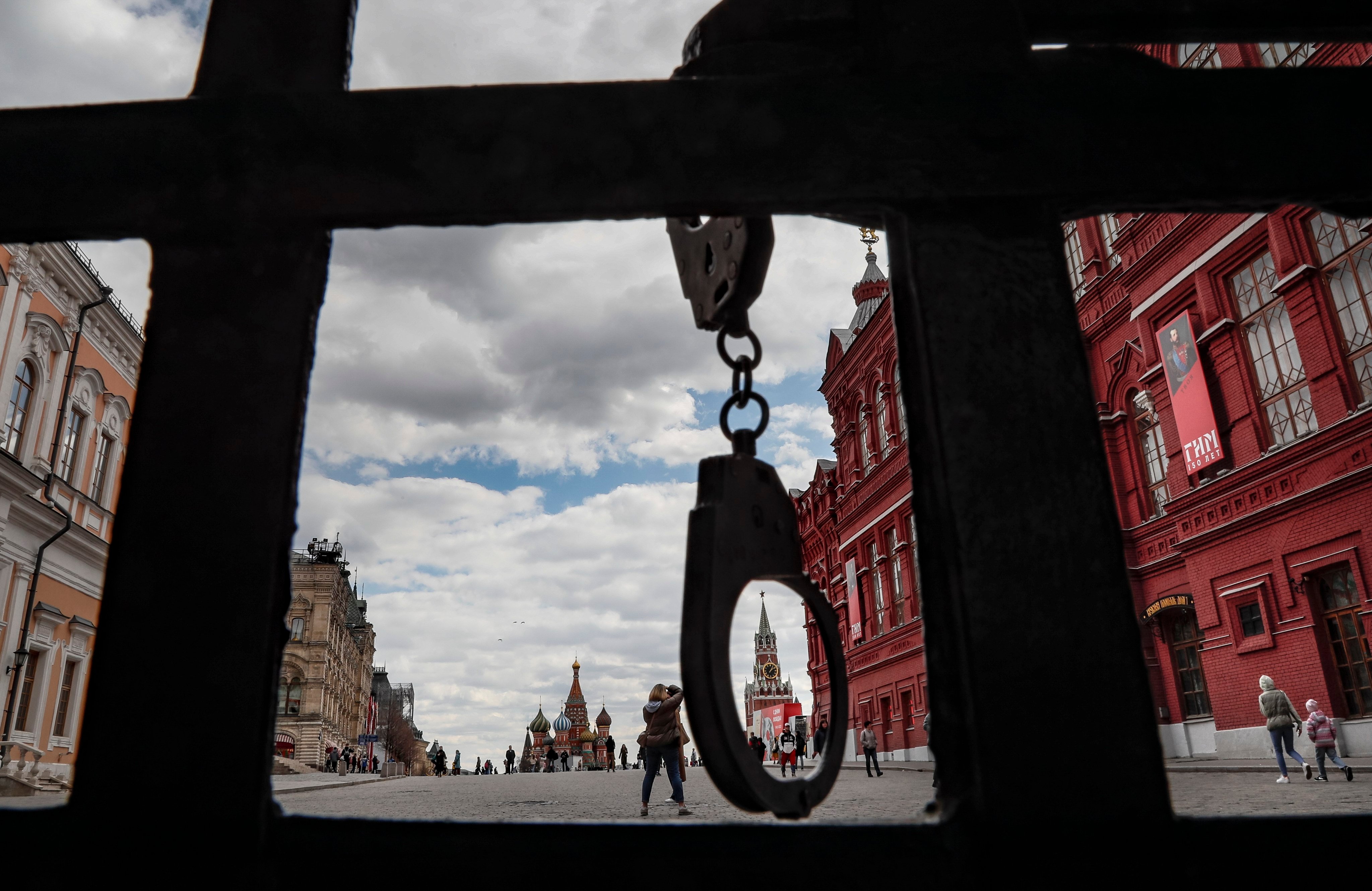 Handcuffs hang from a gate to Red Square in Moscow, Russia. A doctor has been arrested in Moscow for “Satanism” and “promoting same-sex relationships”. Photo: EPA-EFE