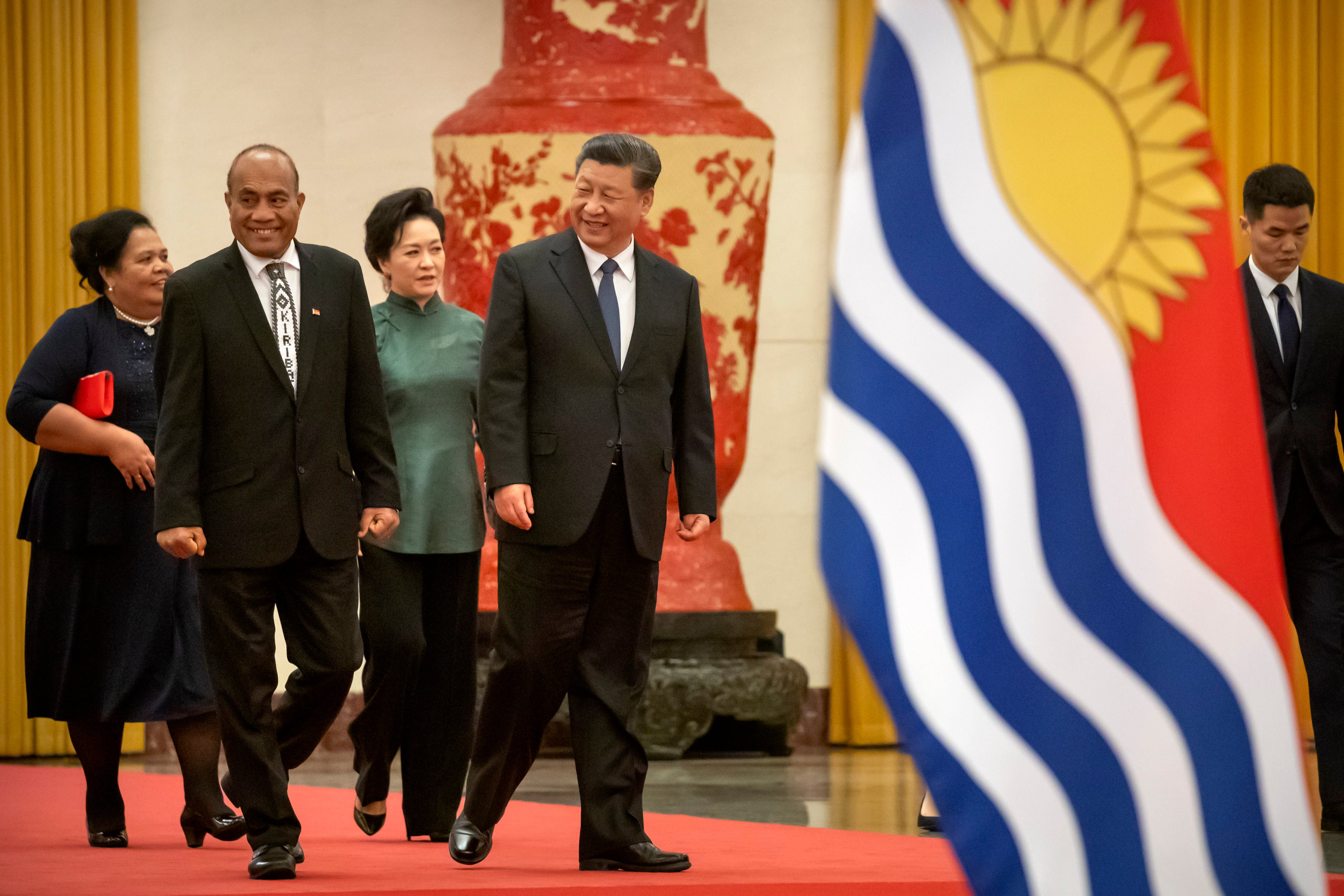 Kiribati’s President Taneti Maamau (left) walks with Chinese President Xi Jinping during a welcome ceremony in Beijing in 2020. Photo: AP 