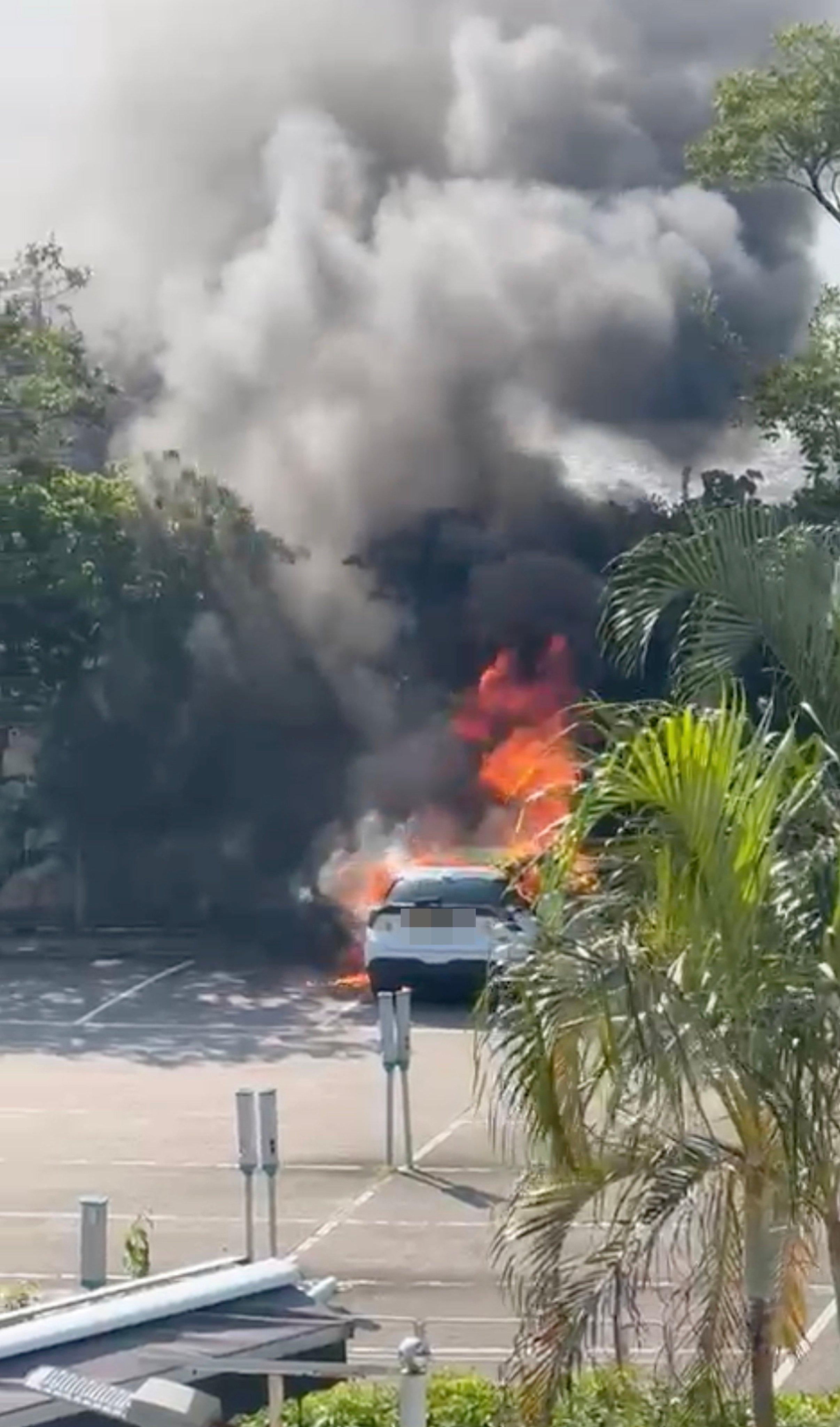 The car in flames in Wong Chuk Wan near Sai Kung on Tuesday morning. Photo: SCMP 