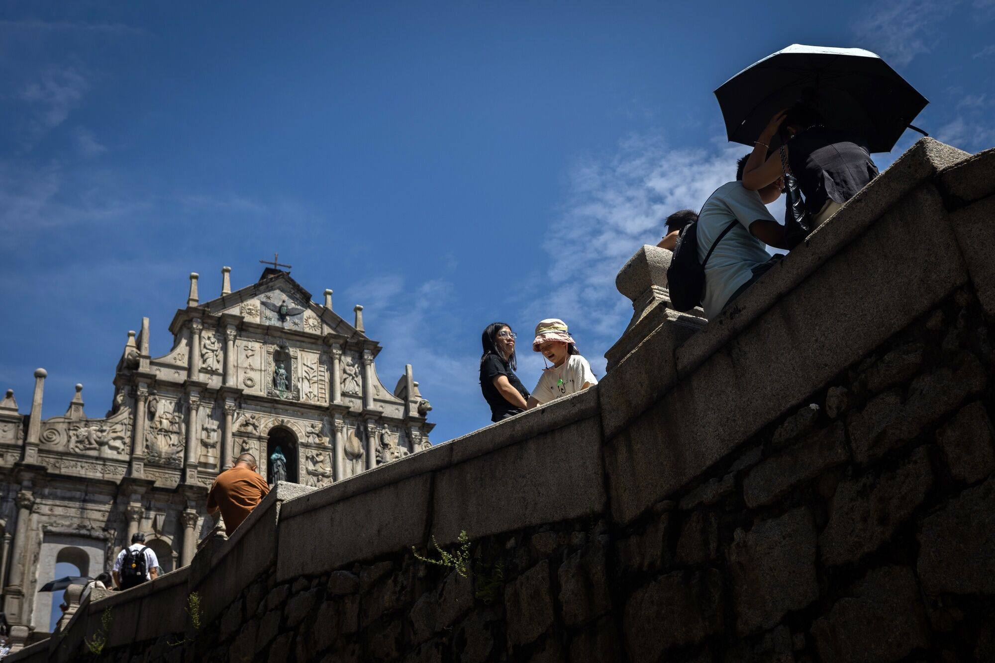 Visitors pictured in the historic heart of Macau, a popular destination for mainland visitors, during last week’s holiday. Photo: Bloomberg