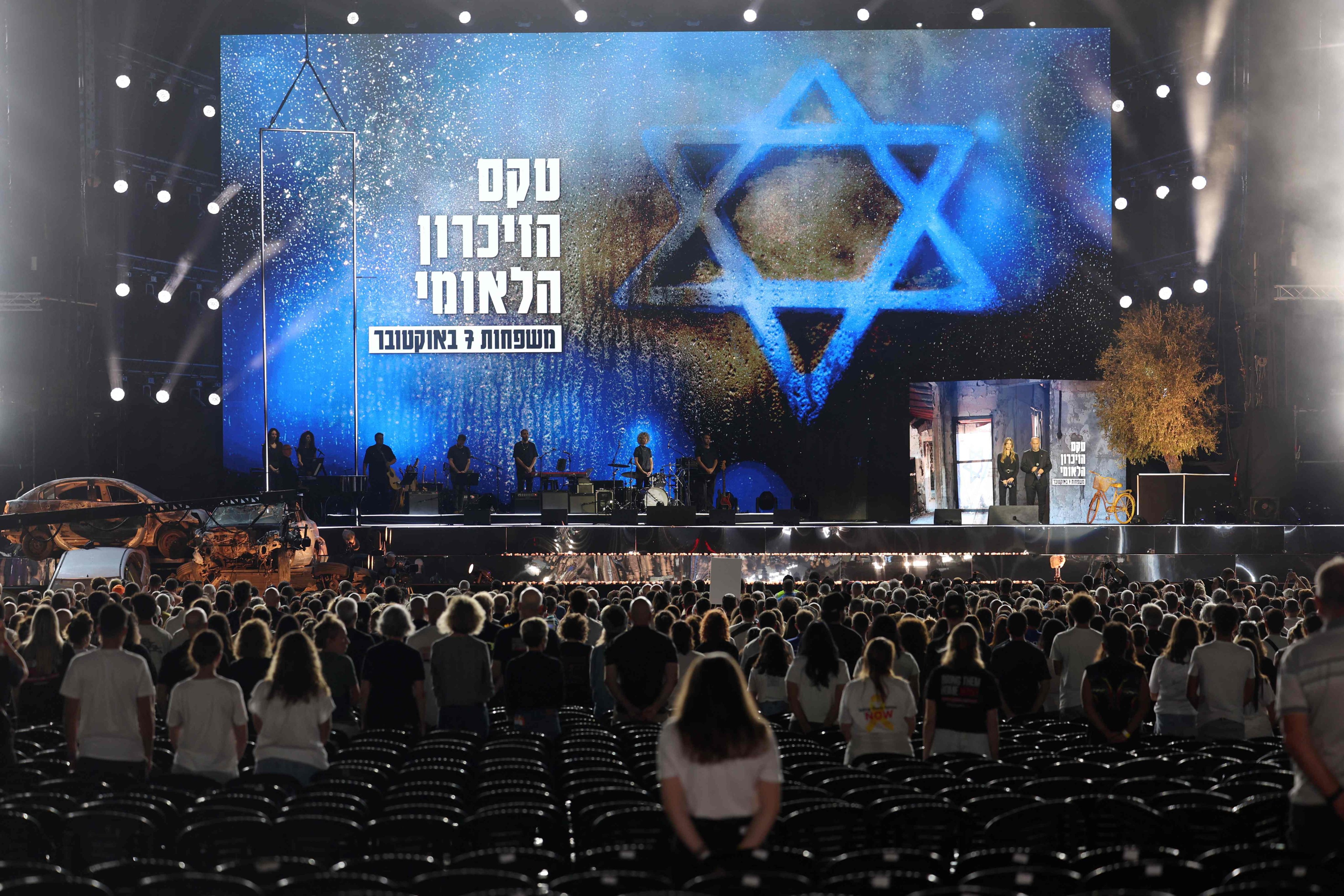 People observe a moment of silence during a memorial ceremony to mark the first anniversary of the October 7 attacks in Tel Aviv, Israel on Monday. Photo: AFP