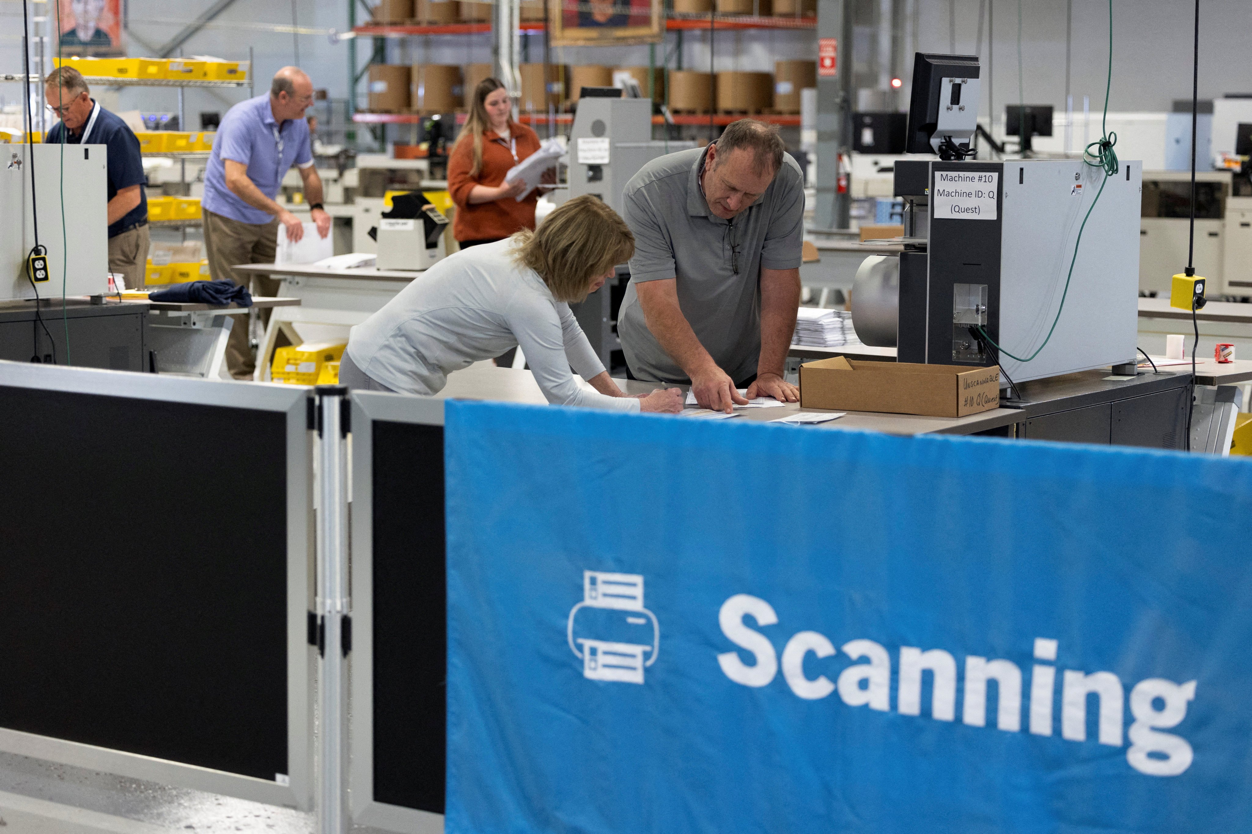 Election officials process ballots at Philadelphia’s vote counting facility in Pennsylvania on April 23. Photo: Reuters 