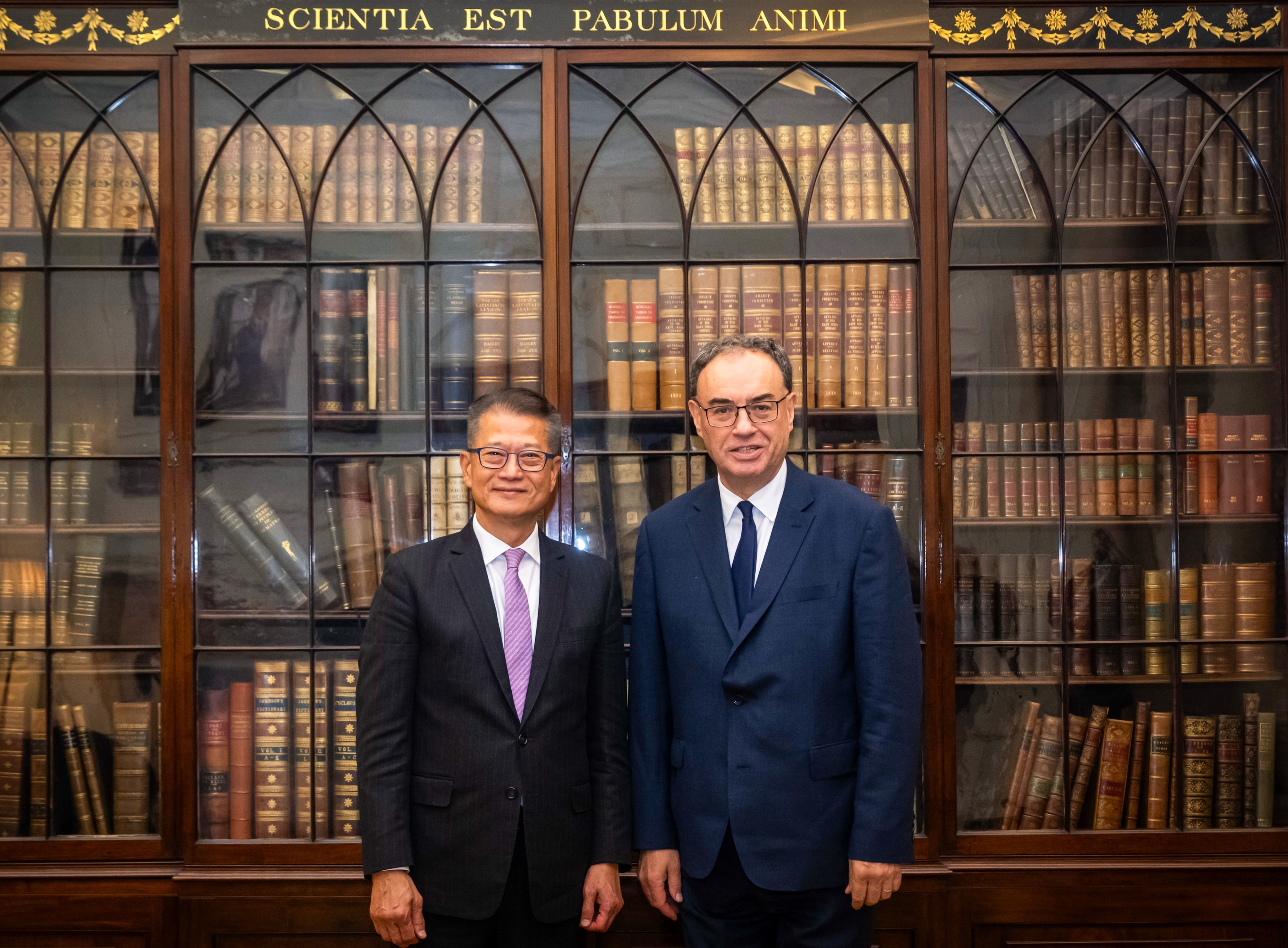 Hong Kong’s finance chief Paul Chan (left) meets with the Governor of the Bank of England, Andrew Bailey, in London on September 26. Photo: ISD handout