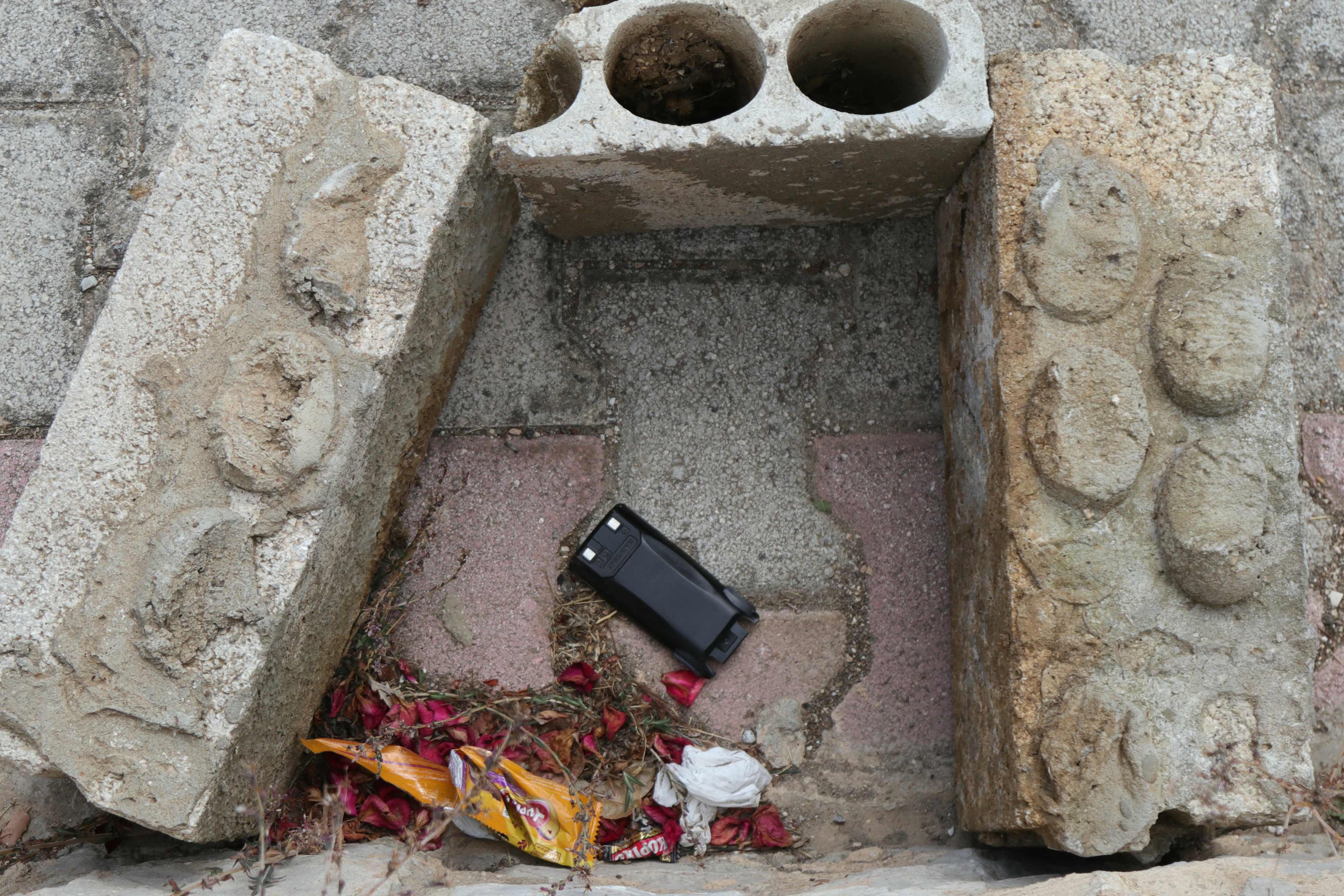 A communication device lies on the ground as Lebanese forces prepare to destroy it in a controlled explosion, between the southern villages of Burj al Muluk and Klayaa, on September 19. Hundreds of pagers and walkie-talkies used by Hezbollah exploded across Lebanon in unprecedented attacks that spanned two days, killing 32 people and wounding more than 3,000 others. Photo: AFP