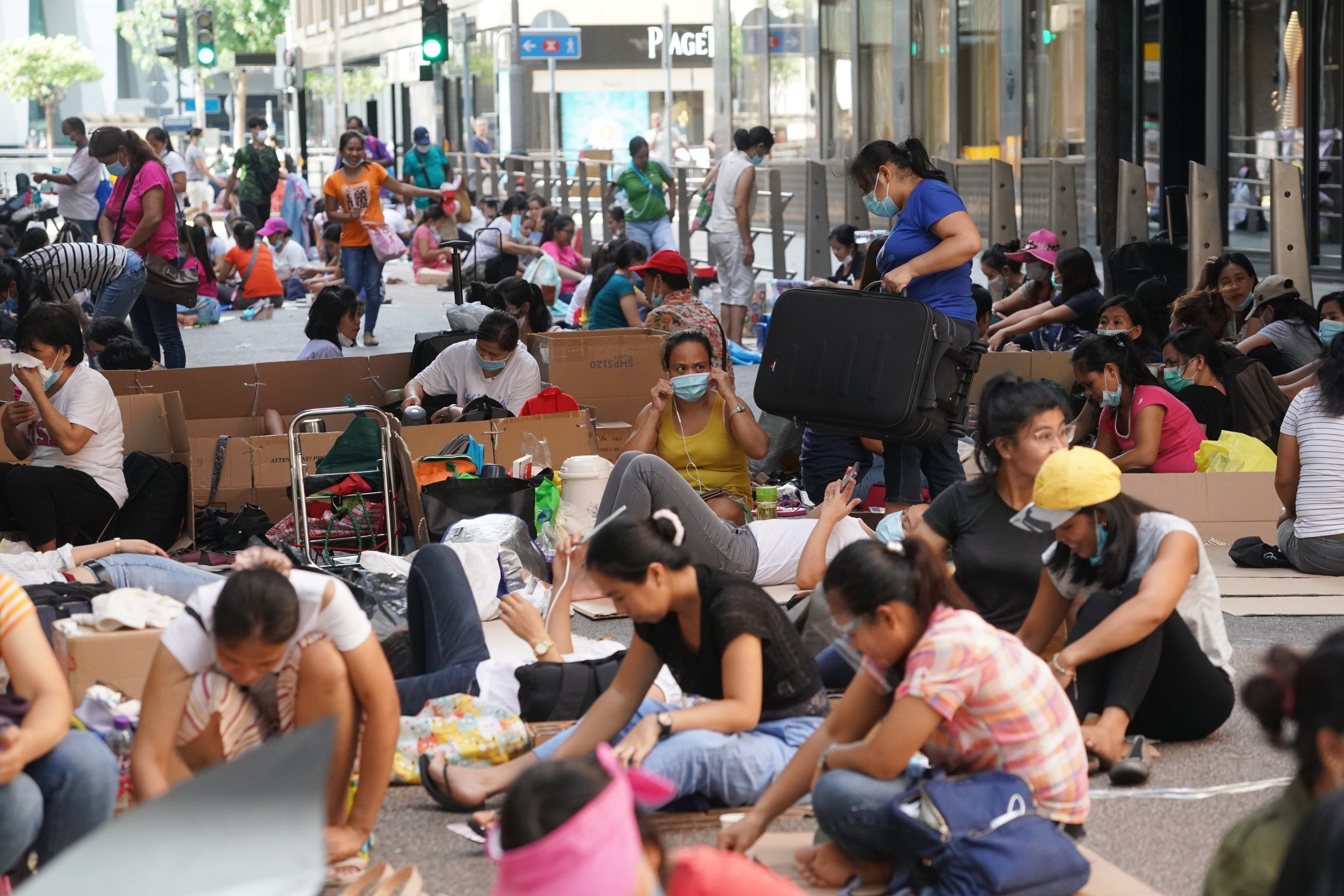 Domestic helpers gather in Central, Hong Kong, to enjoy a day off work. Photo: Felix Wong