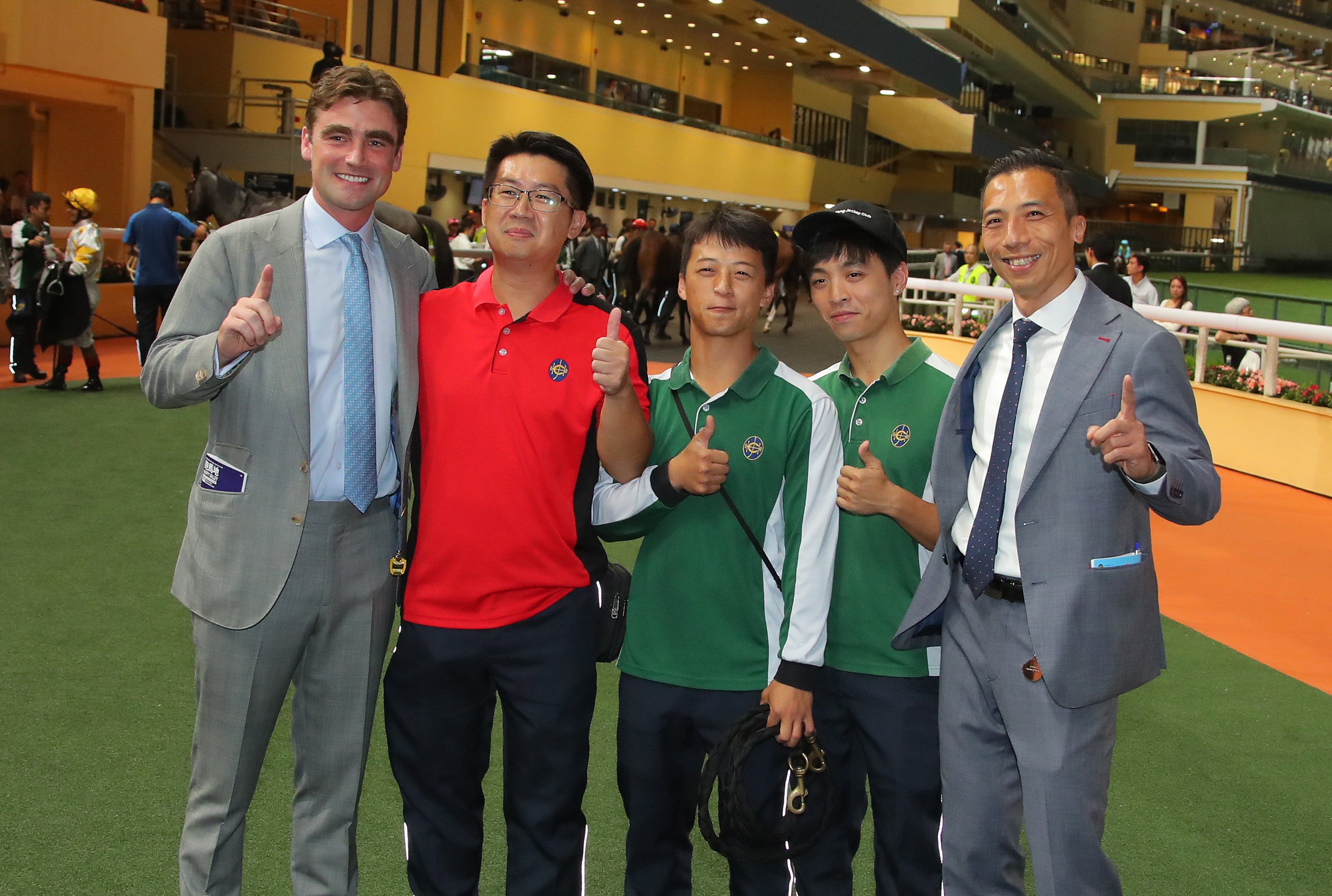 David Eustace (left) celebrates his first Hong Kong victory with stable staff at Happy Valley. Photos: Kenneth Chan