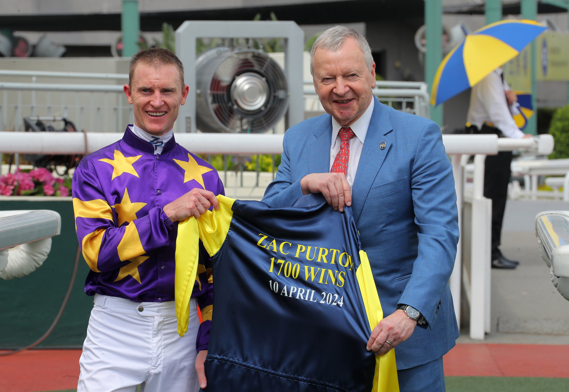 Winfried Engelbrecht-Bresges (right) presents Zac Purton with a commemorative award.