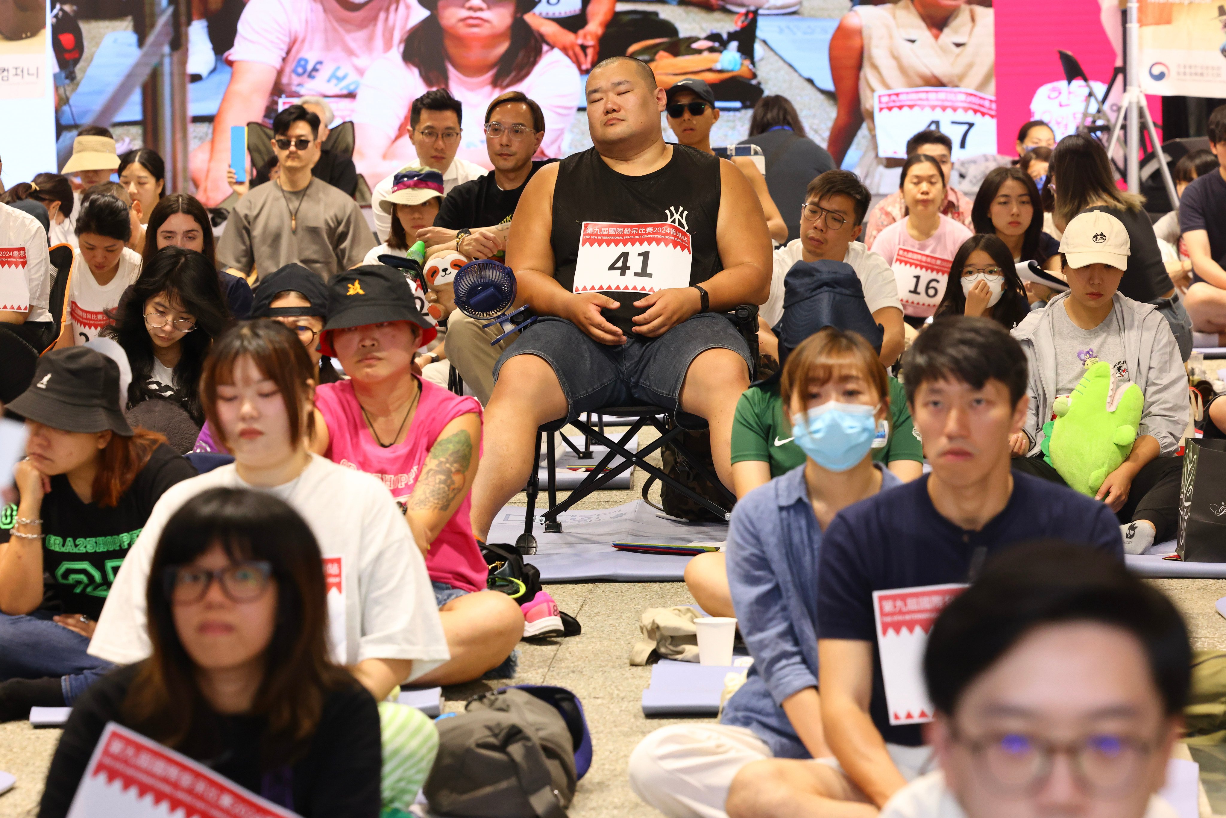 Many contestants dressed in playful outfits and brought their own chairs to help them space out for 90 minutes. 05OCT24   SCMP / Dickson Lee