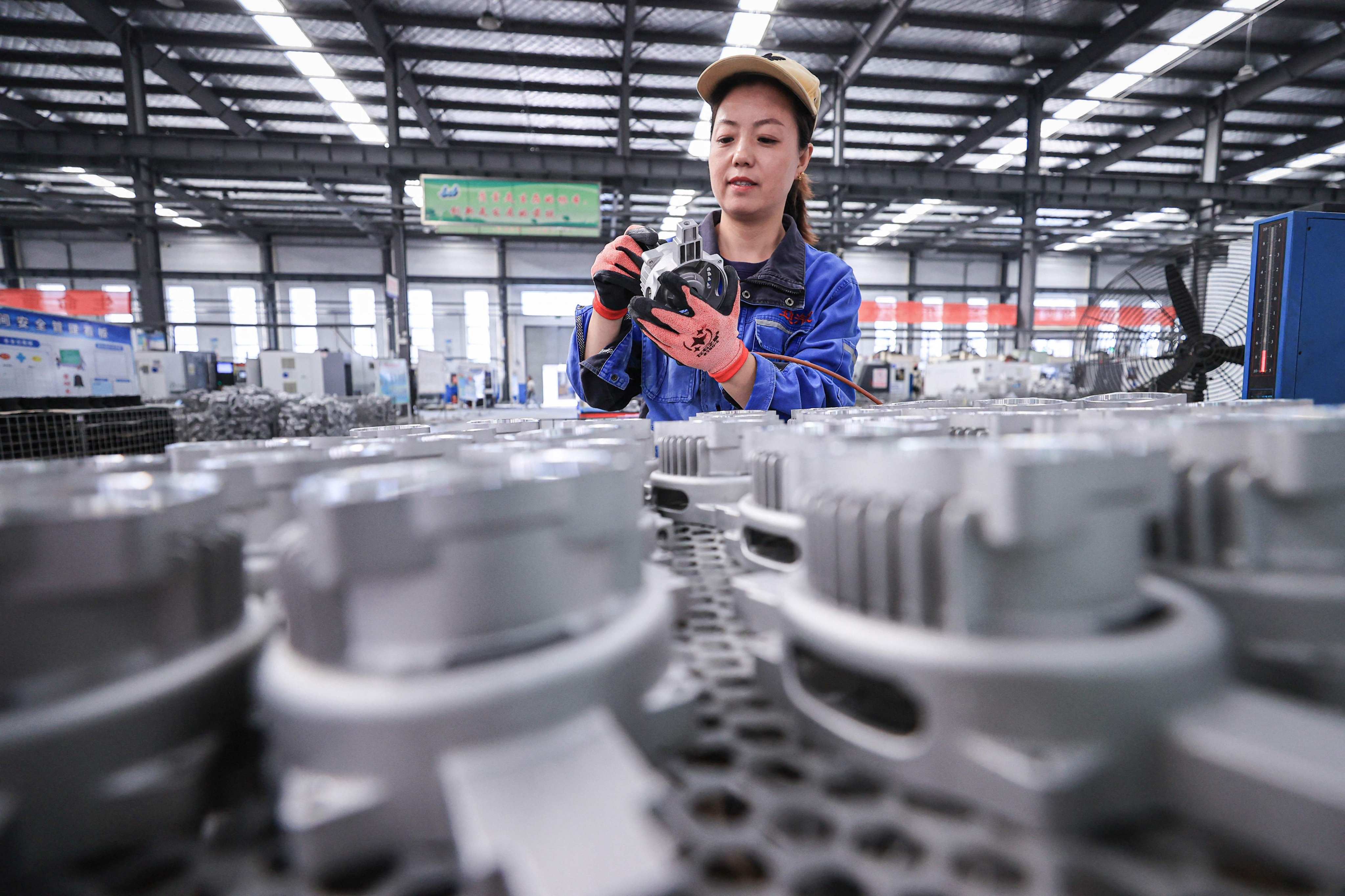 An employee works at a factory which produces car parts in Lianyungang, in eastern China’s Jiangsu province. Photo: AFP