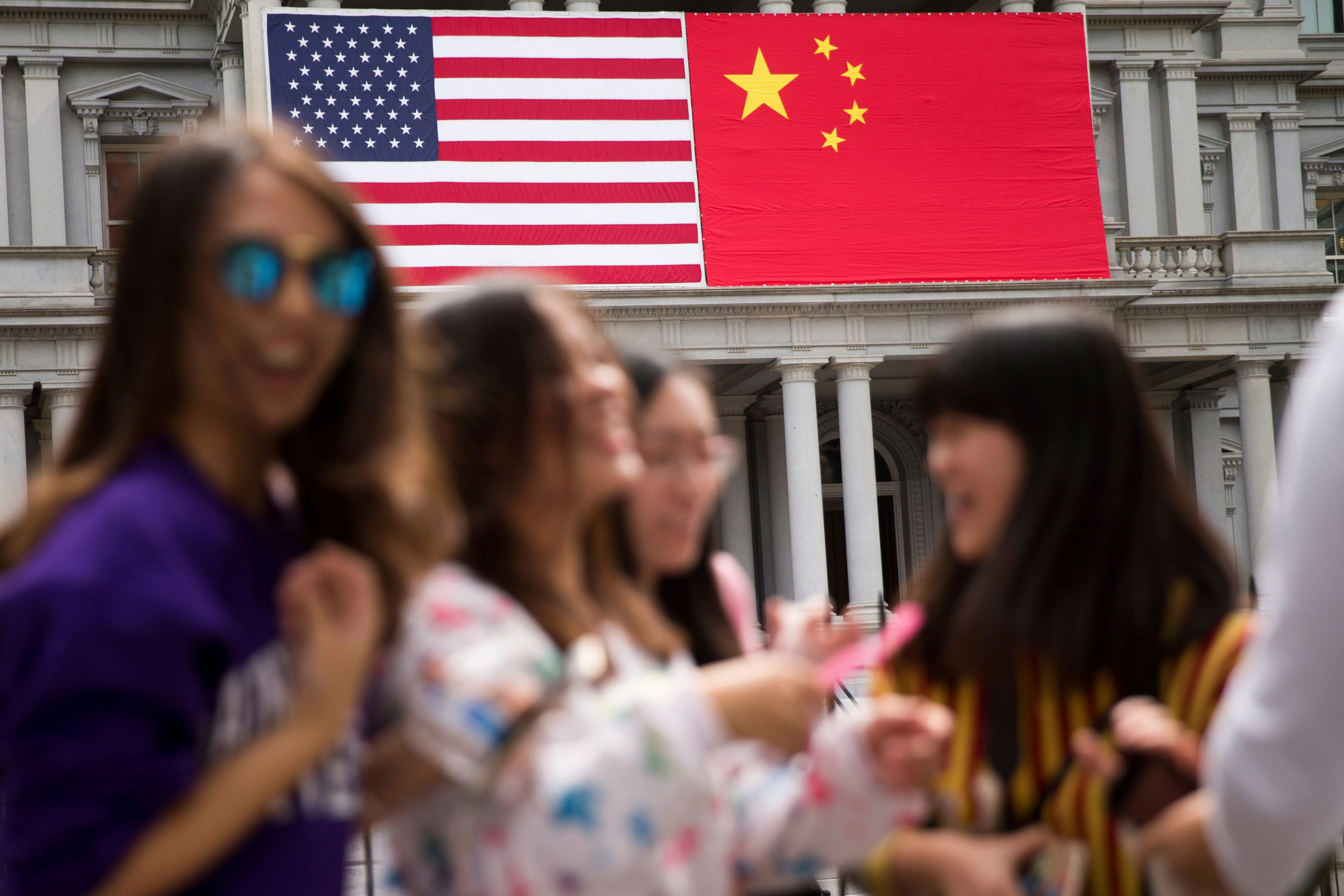 China’s flag is displayed next to the American flag on the side of the Old Executive Office Building on the White House complex, the day before a September 2015 state visit to Washington by Chinese President Xi Jinping. Photo: AP