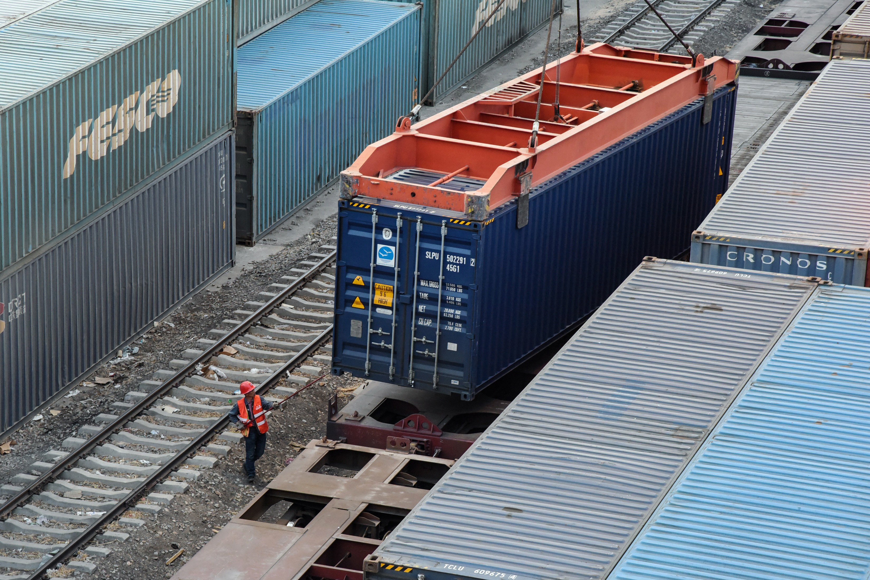 A worker loading a container on a train of the China Railway Express to Europe in the Chinese border city of Erenhot. Photo: AFP