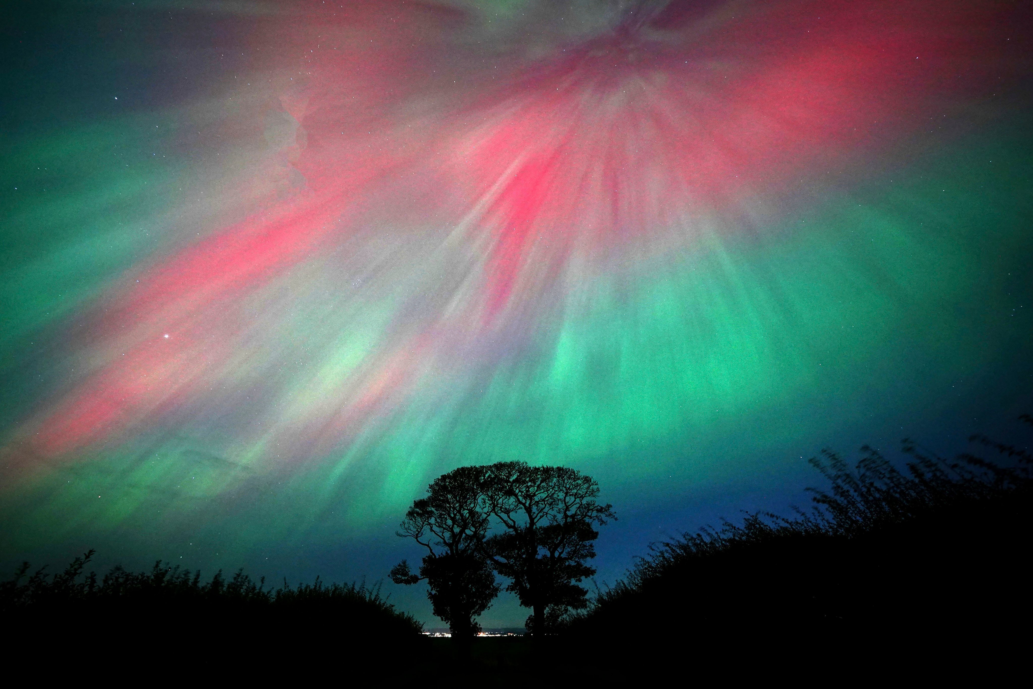 The northern lights, also known as the aurora borealis, seen over Scotland. Geomagnetic storms can cause the phenomena. Photo: AP