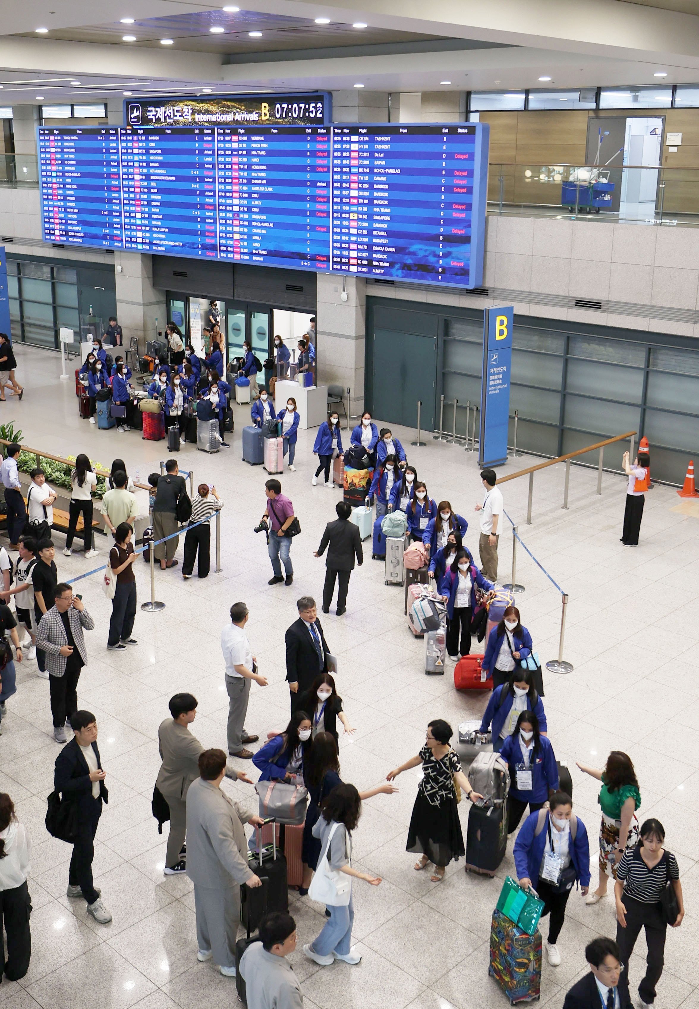 Filipino women participating in a pilot nanny programme arrive at Incheon airport in South Korea on August 6. Photo: EPA-EFE/Yonhap
