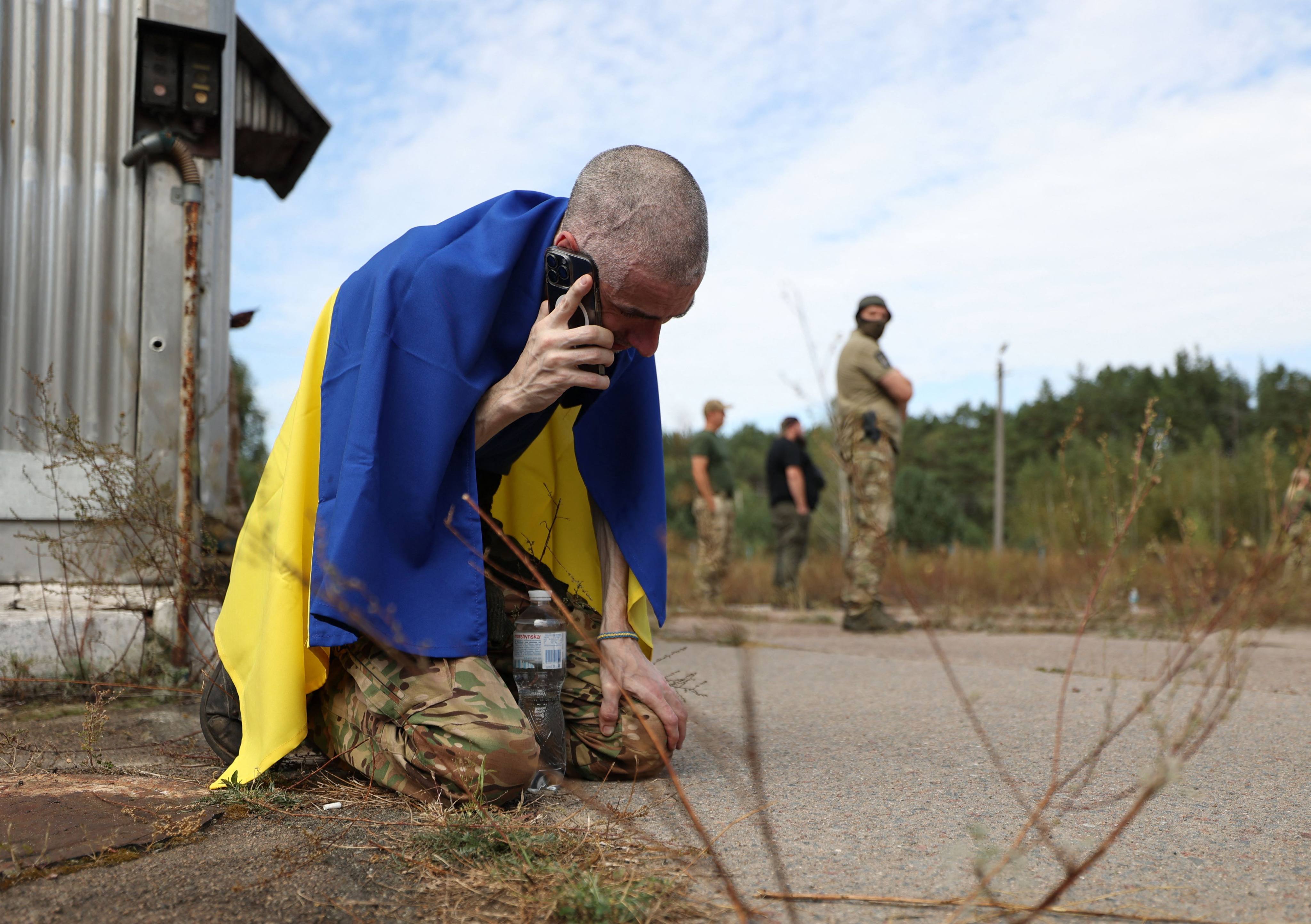 A Ukrainian serviceman calls home after being released from Russian captivity at an undisclosed location near the Ukrainian-Belarusian border on September 13. Ukraine has intensified its mobilization drive this year, reflecting the country’s dire need for fresh recruits. Photo: AFP