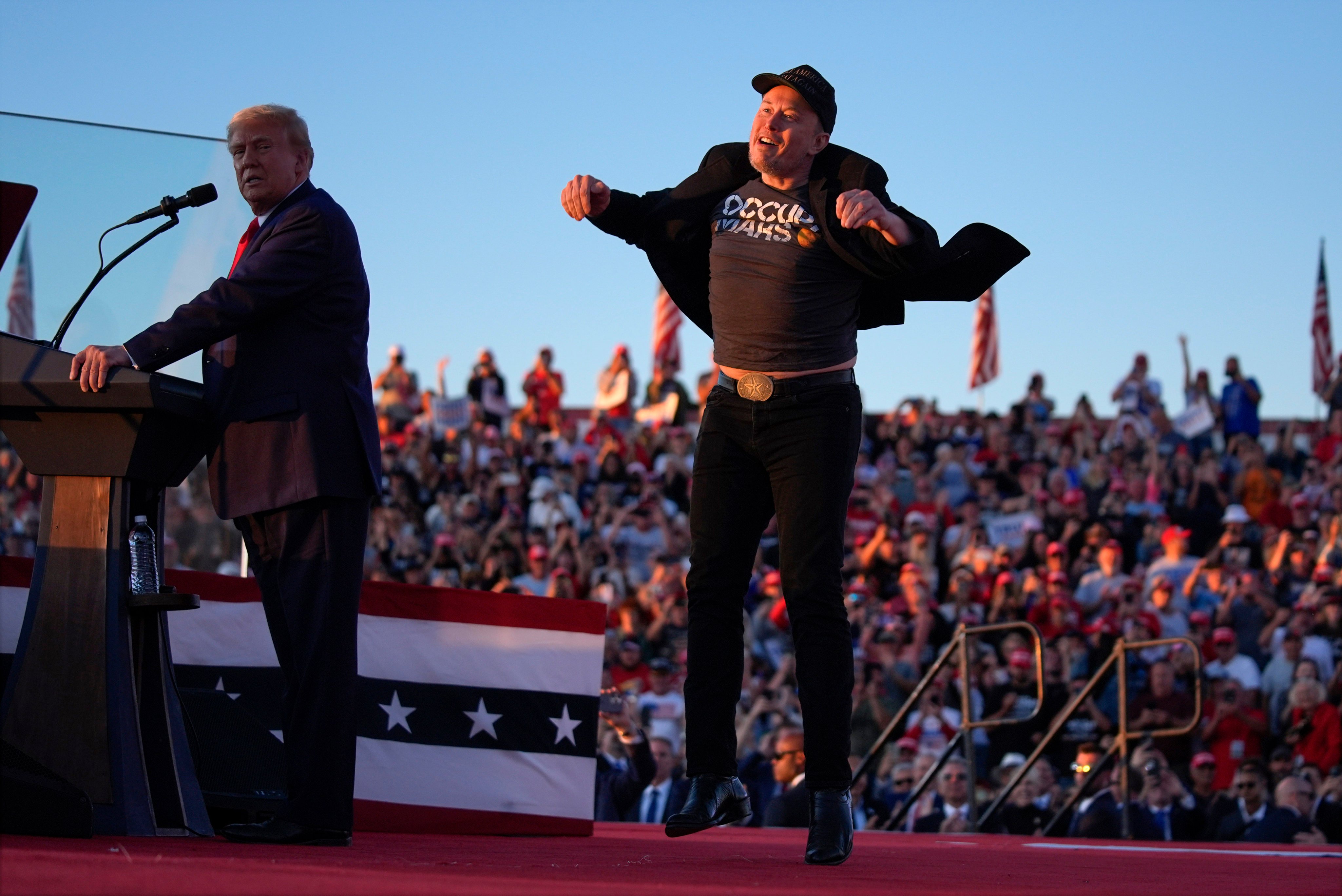 Elon Musk (right) jumps on the stage as Republican presidential nominee Donald Trump speaks at a campaign rally in Pennsylvania on October 5. Photo: AP