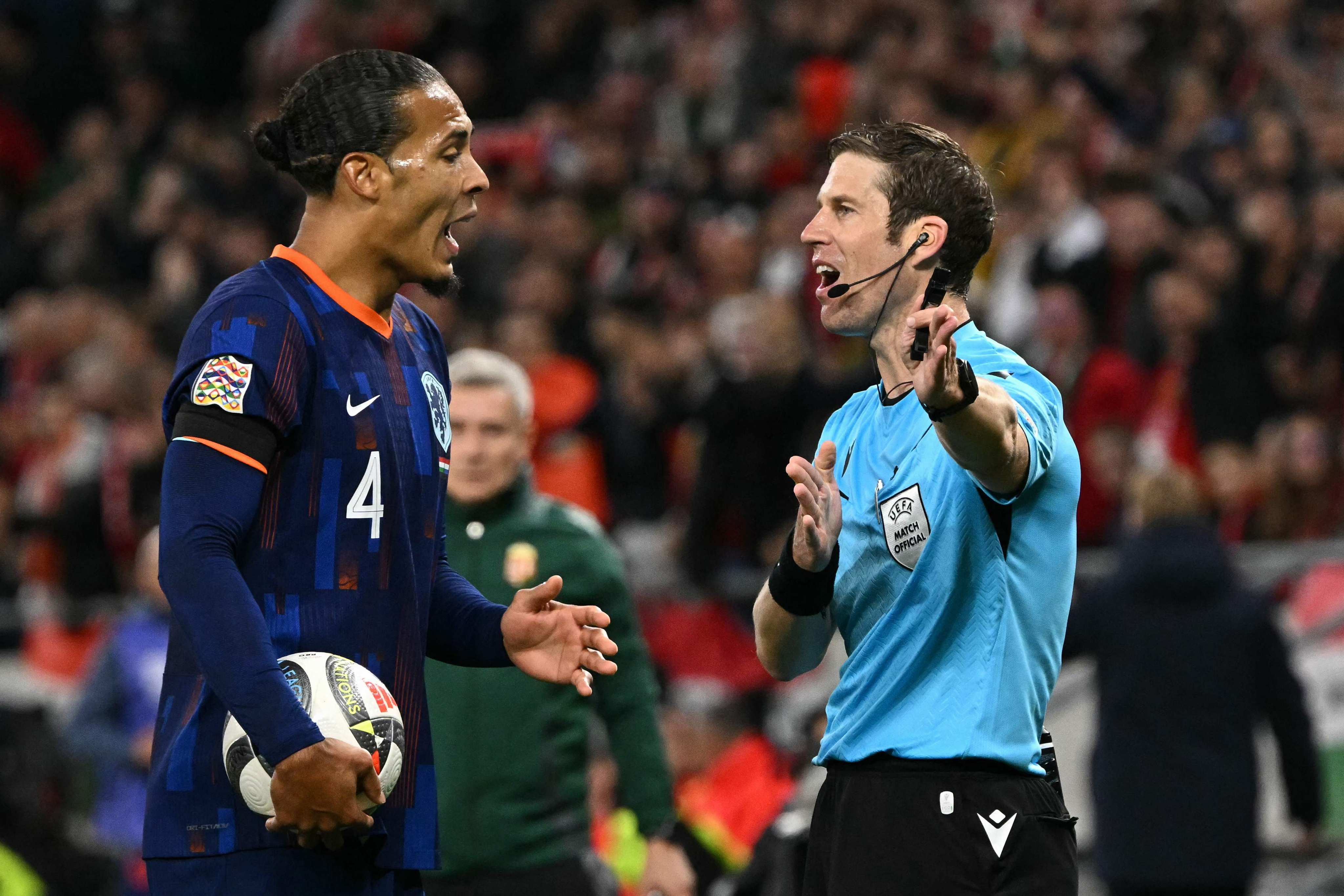 Netherlands centre-back Virgil van Dijk is sent off by Swiss referee Lukas Faehndrich. Photo: AFP