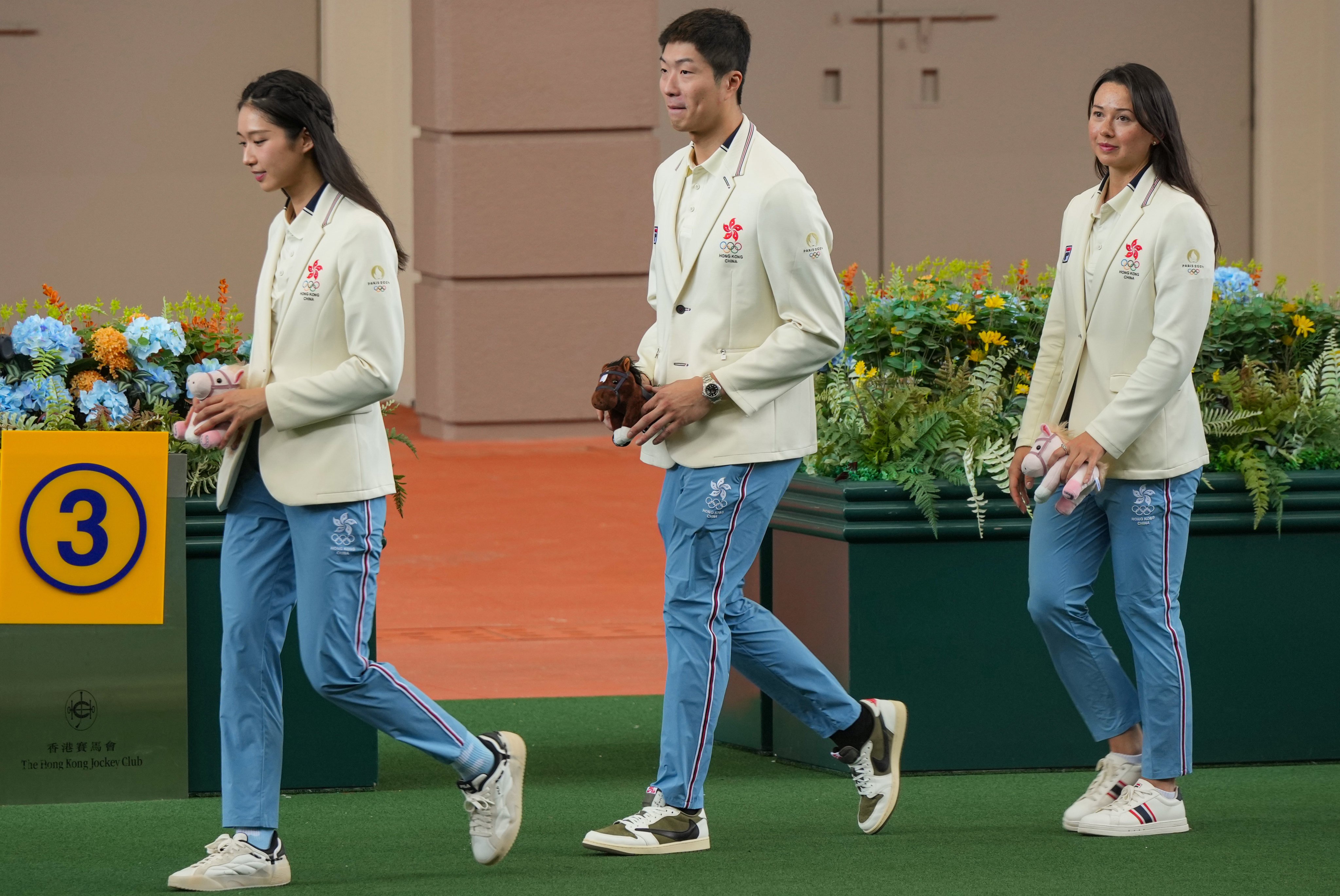 Medallists (from left) Vivian Kong, Cheung Ka-long and Siobhan Haughey attend the cheque presentation ceremony at Sha Tin Racecourse. Photo: May Tse