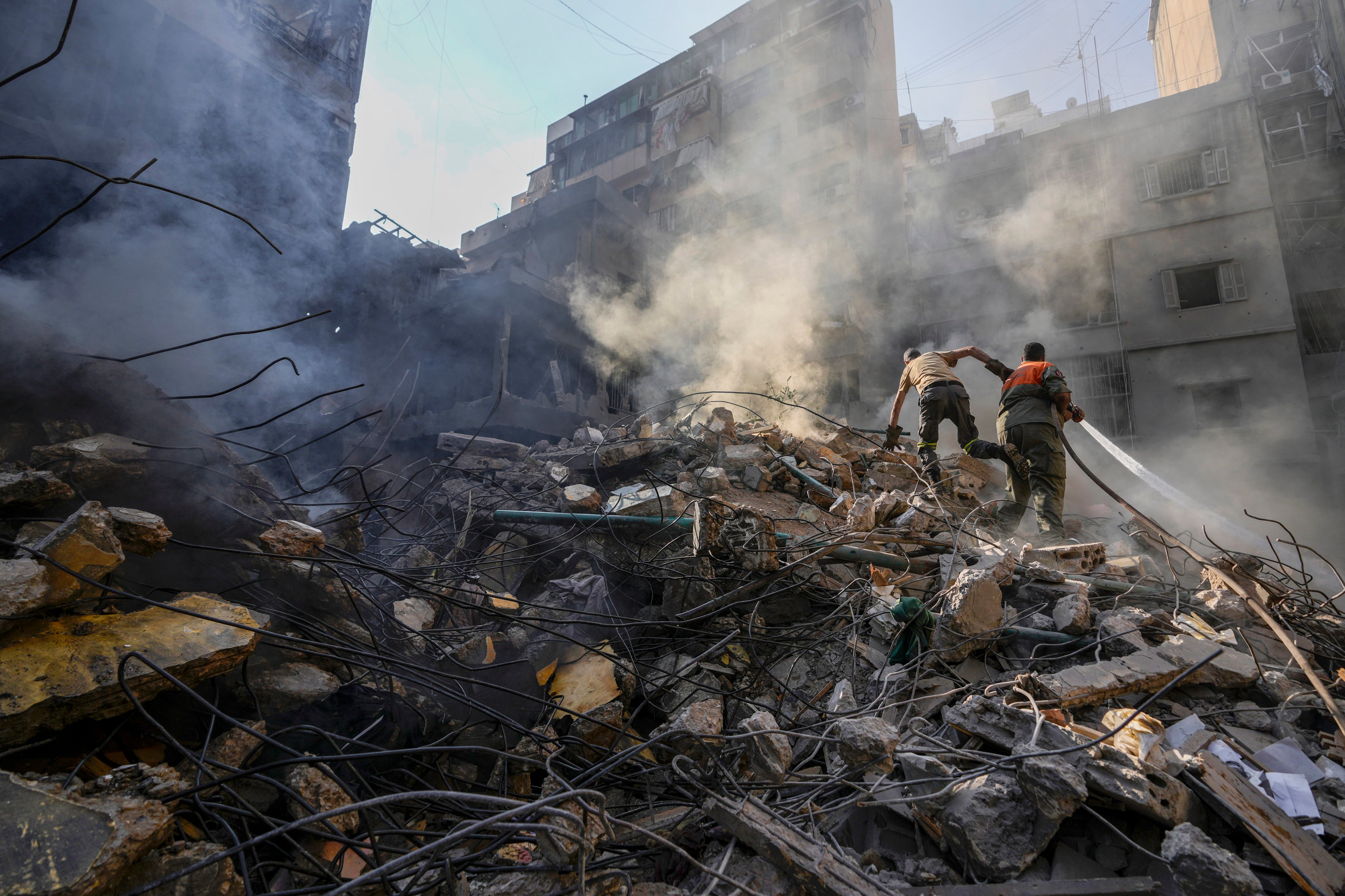 Rescuers search for victims at the site of an Israeli air strike in Beirut, Lebanon, on Friday. Photo: AP