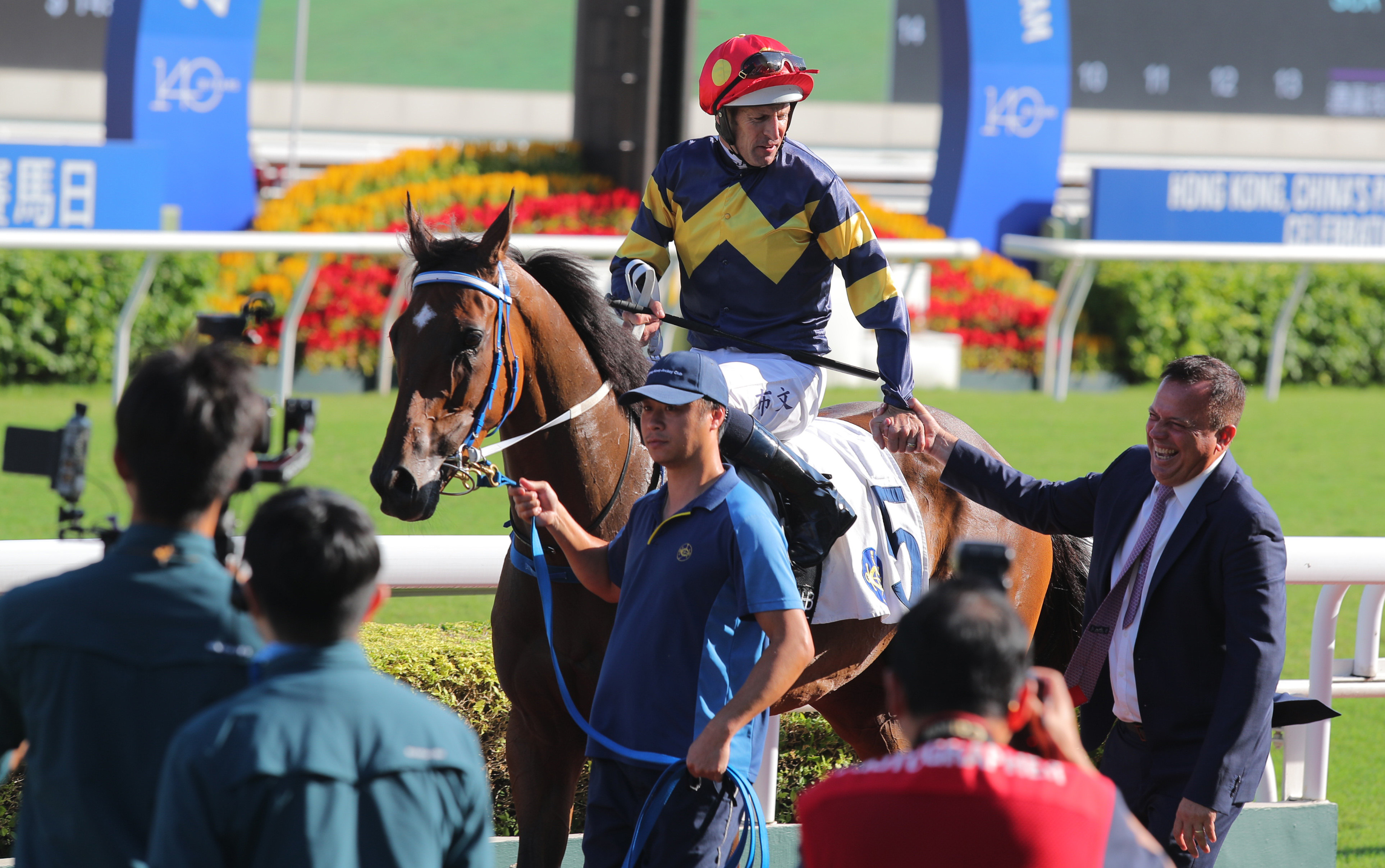 Hugh Bowman and Caspar Fownes celebrate Family Jewel’s latest win at Sha Tin. Photos: Kenneth Chan