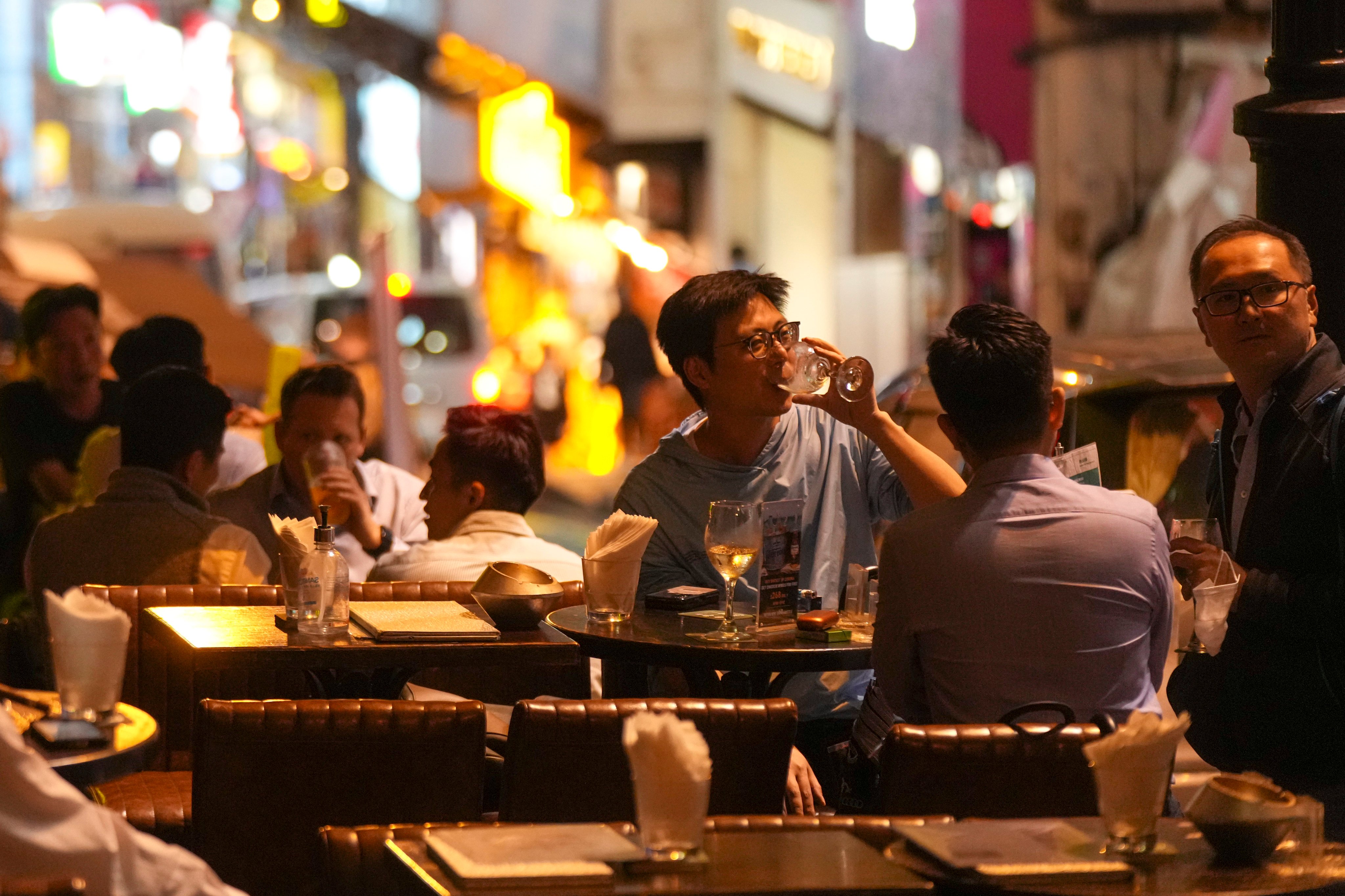 People enjoy a night out at a bar in Hong Kong’s Central district in November 2022. Industry groups are calling for the tax on hard liquor to be lowered to spur the city’s economy. Photo: Sam Tsang