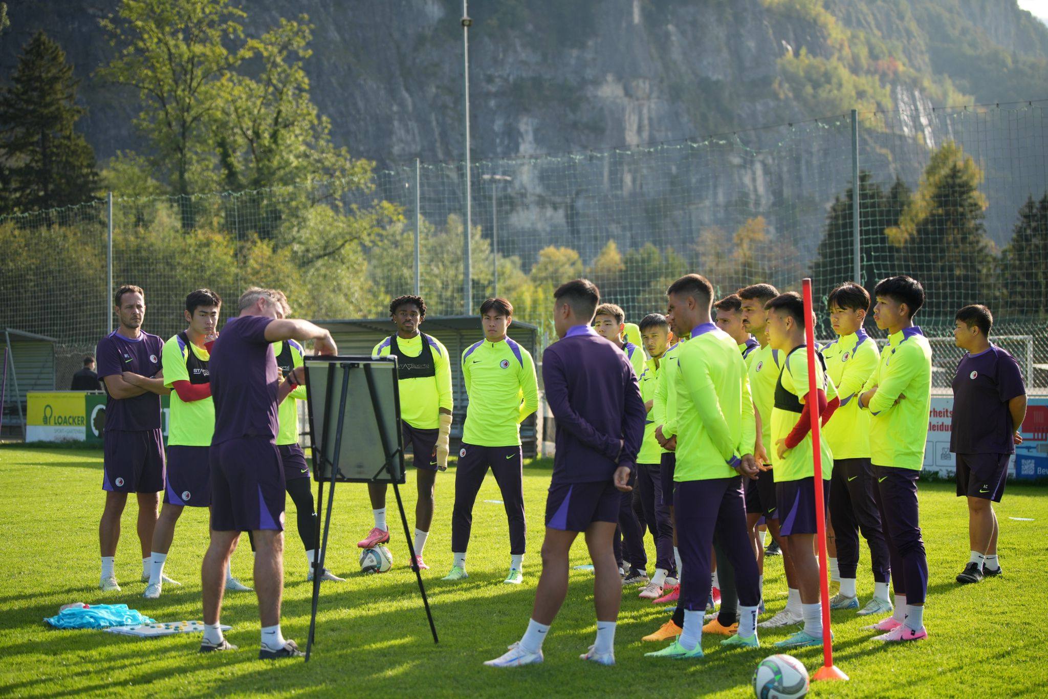 Hong Kong’s players listen to head coach Ashley Westwood during training. Photo: HKFA