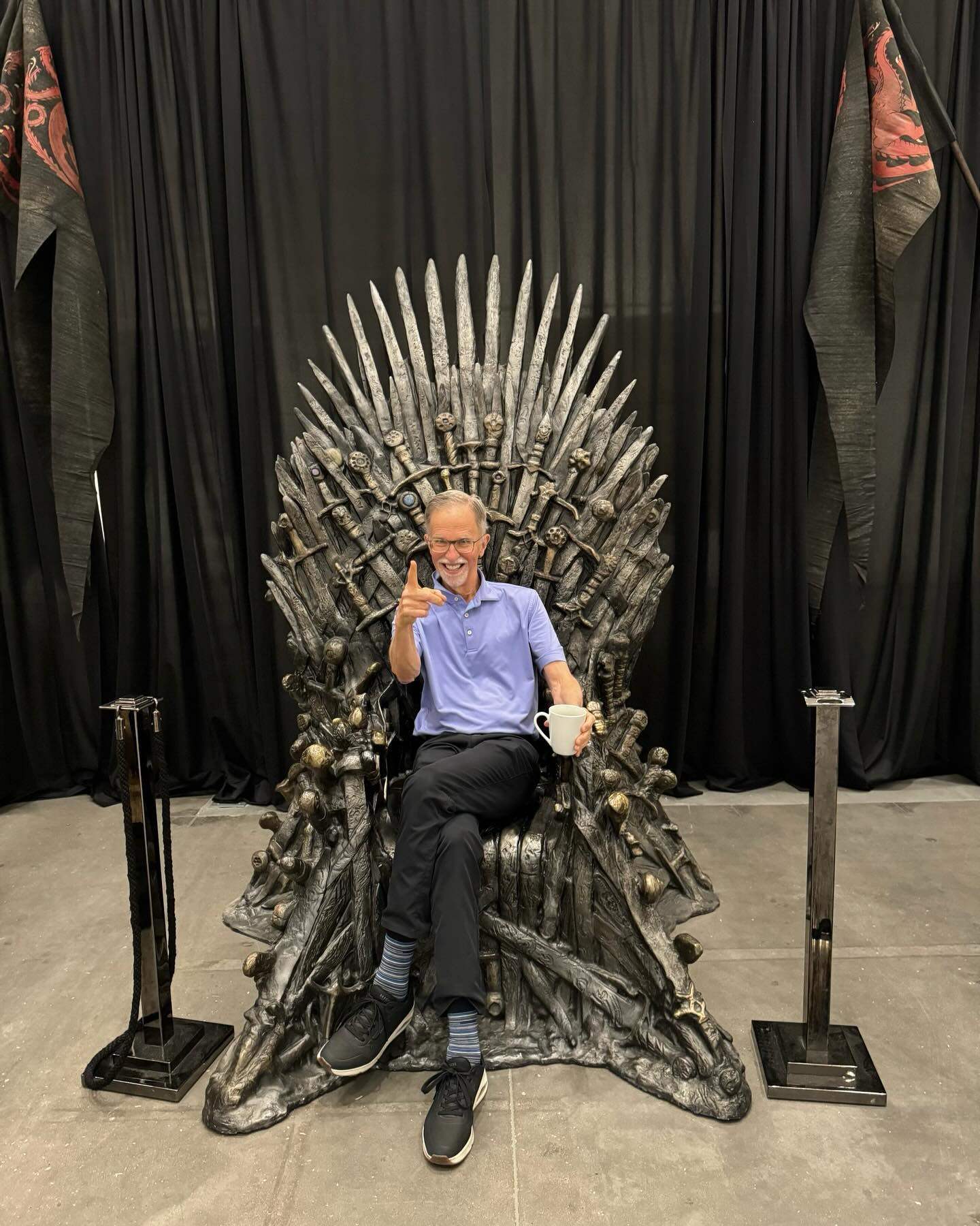 Heritage Auctions chief executive officer Steve Ivy sits on the moulded plastic replica of the Iron Throne from Game of Thrones before its sale for US$1.49 million. Photo: Facebook/Heritage Auctions