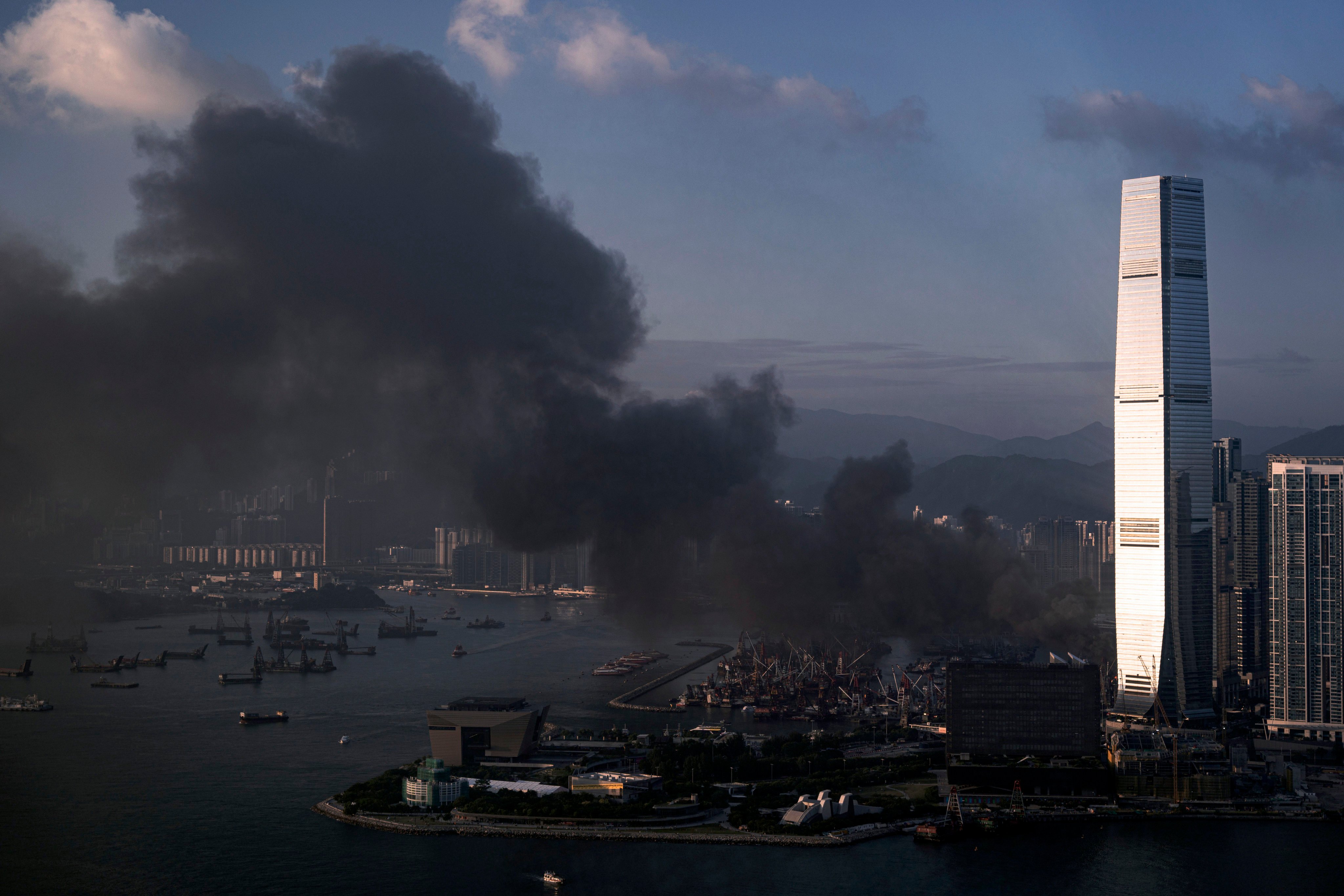 Thick smoke billows into the sky from the Yau Ma Tei cargo working area. Photo: Robert Ng