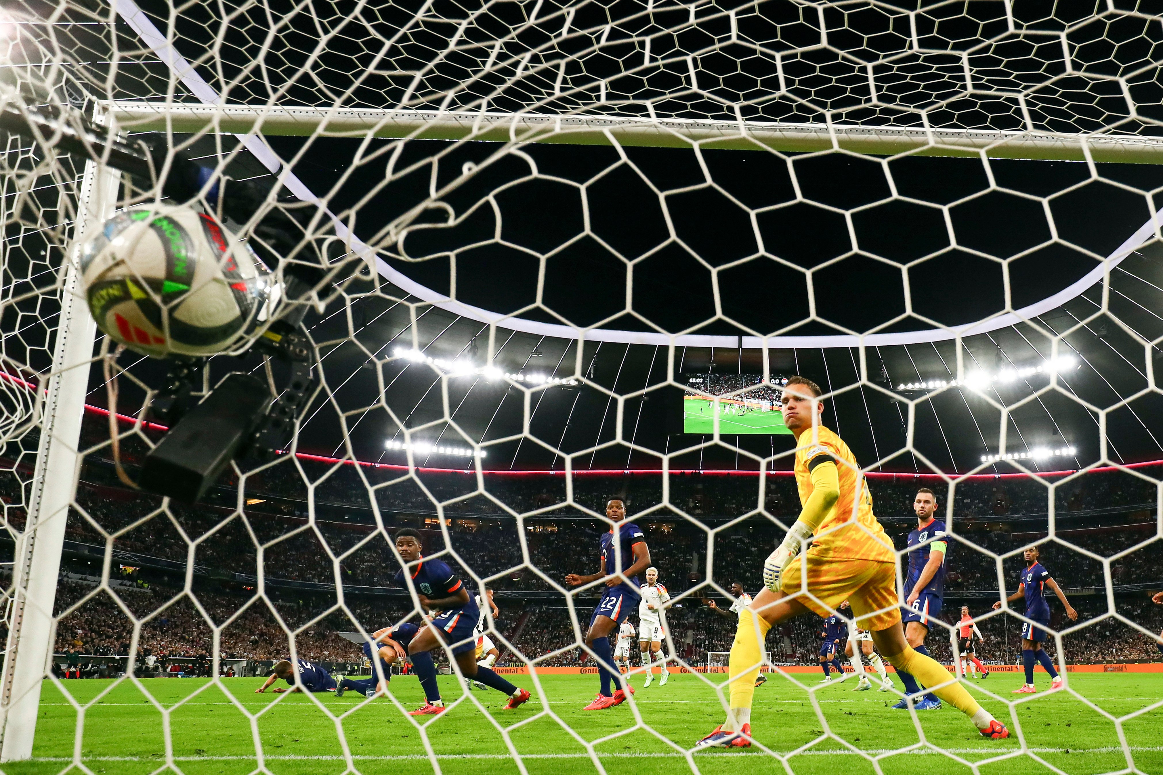 Netherlands goalkeeper Bart Verbruggen looks back at the ball after Germany’s Jamie Leweling scores in Munich. Photo: AP