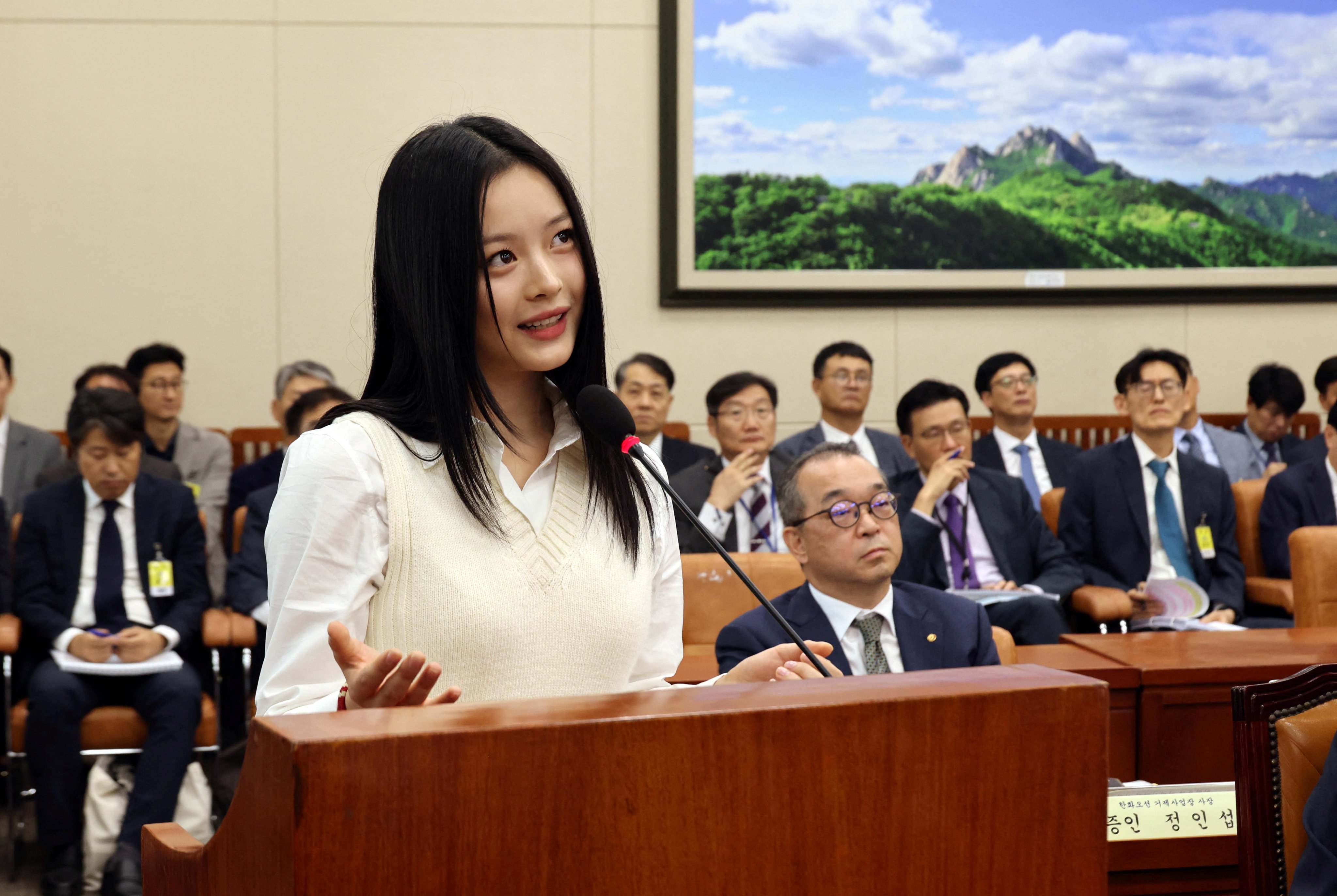 K-pop star Hanni, a member of the group NewJeans, attends a South Korean National Assembly’s Environment and Labour Committee meeting in Seoul. Photo: Reuters