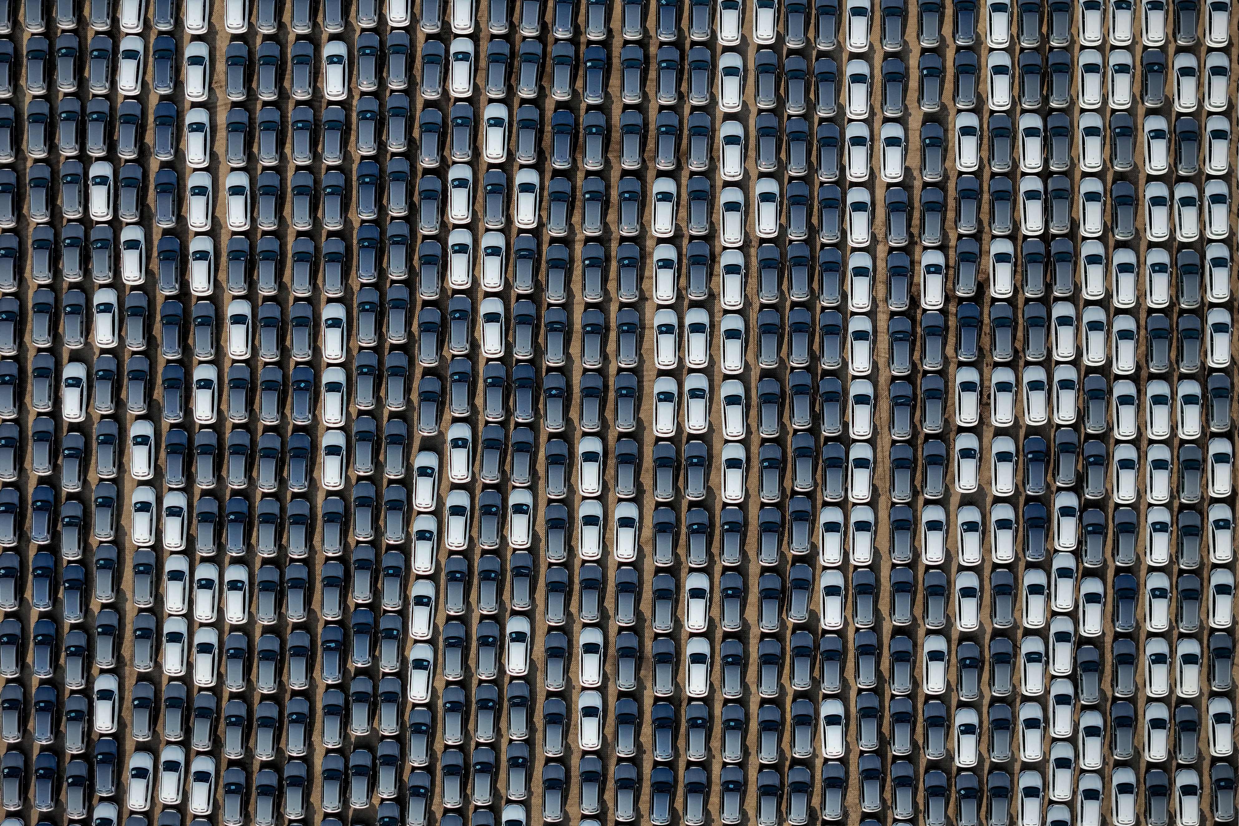 BYD electric cars for export wait to be loaded onto a ship at Yantai port in eastern China’s Shandong province, on April 18. The tariffs on Chinese electric vehicles and other imports not only undermine the global economy but could also thwart global climate ambitions. Photo: AFP  