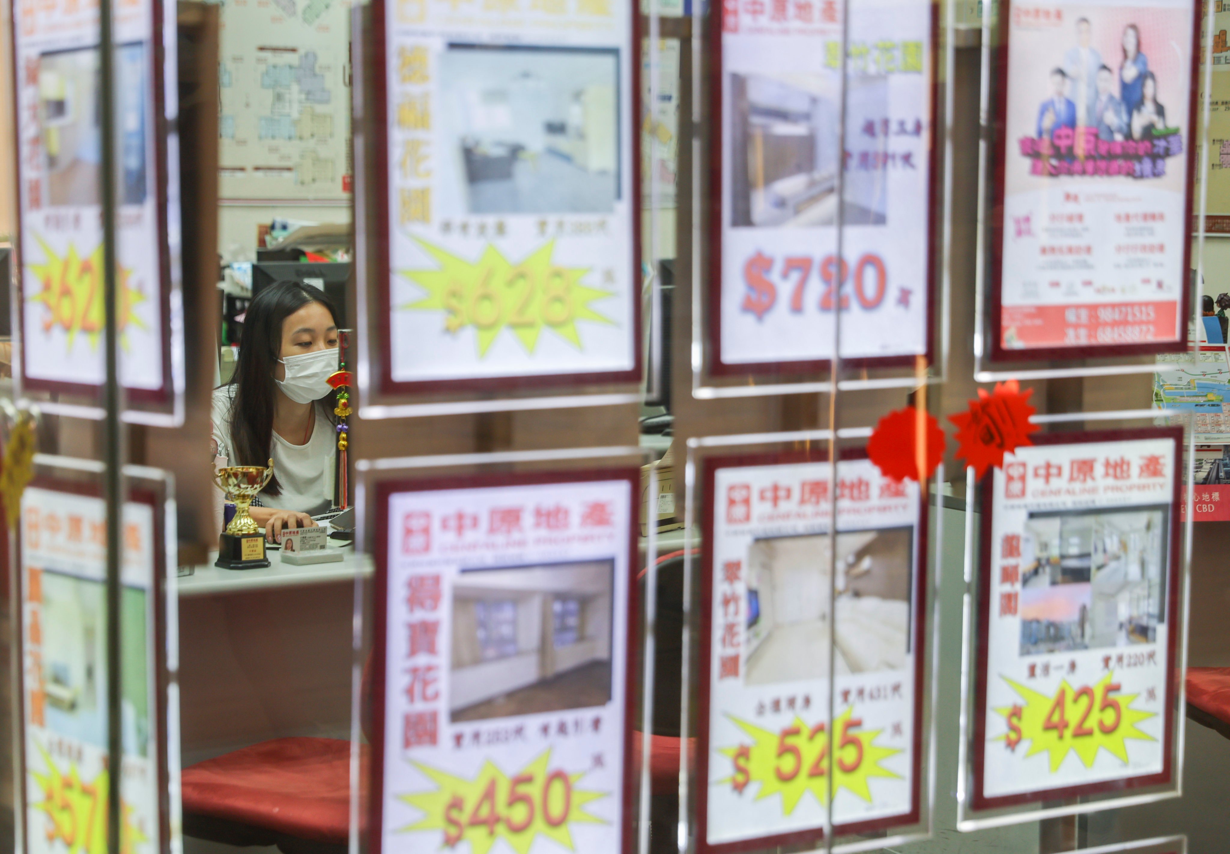 An agent works at a real estate agency in Hong Kong’s Wong Tai Sin district, on July 19, 2022. Photo: Edmond So