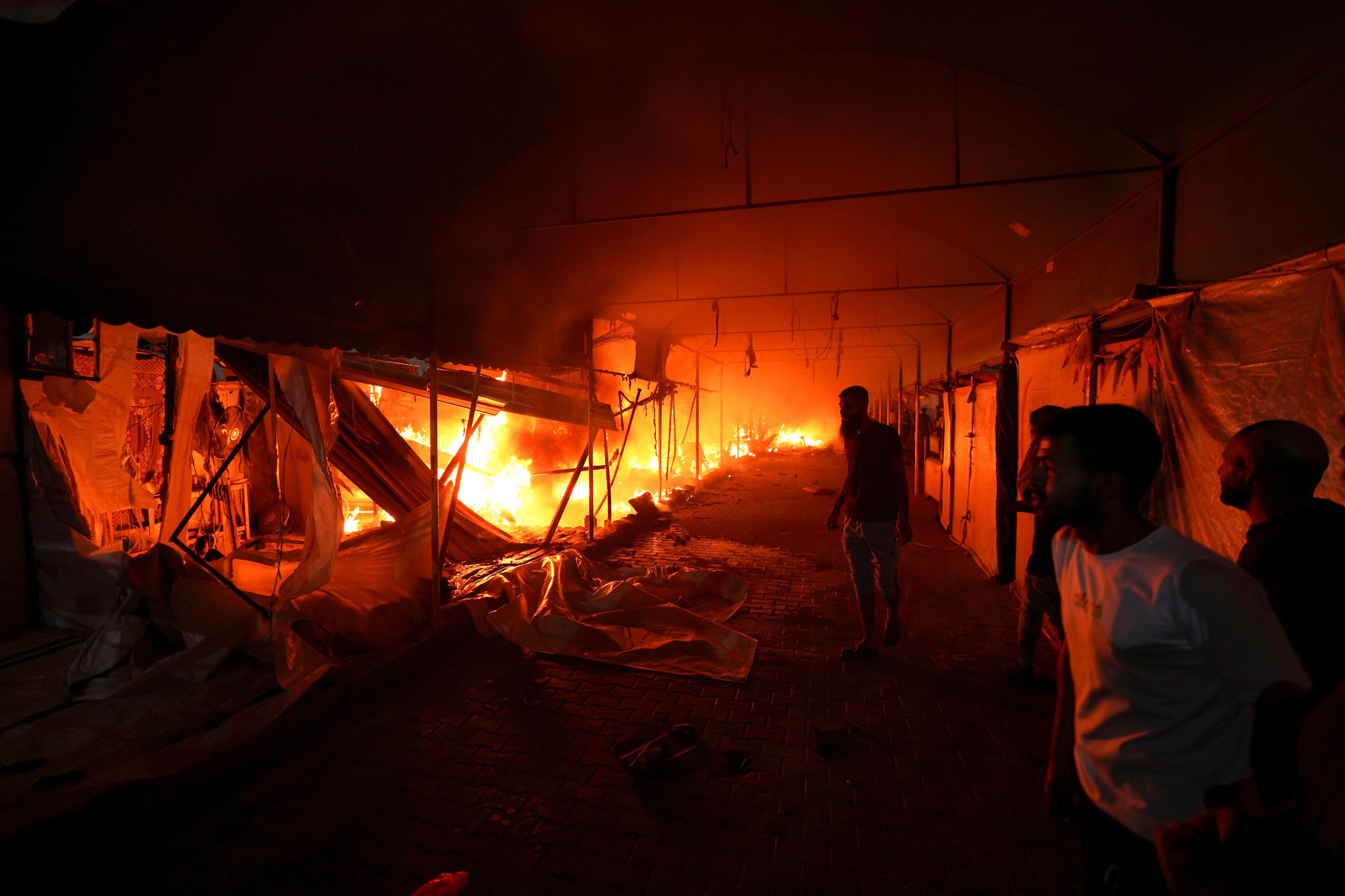 An Israeli strike started a fire on a tent area in a Gaza hospital courtyard on Monday. Photo: AP