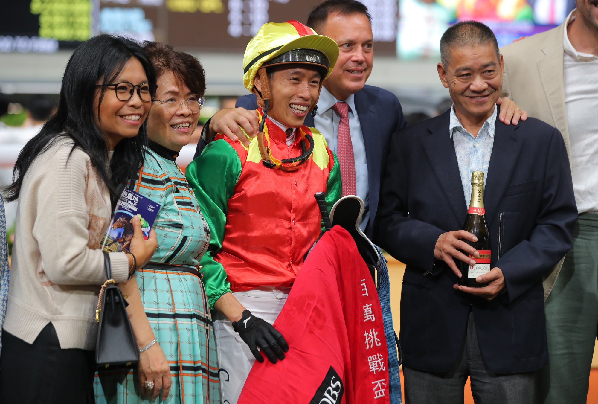 Jockey Vincent Ho, trainer Caspar Fownes and connections of Jumbo Legend celebrate.