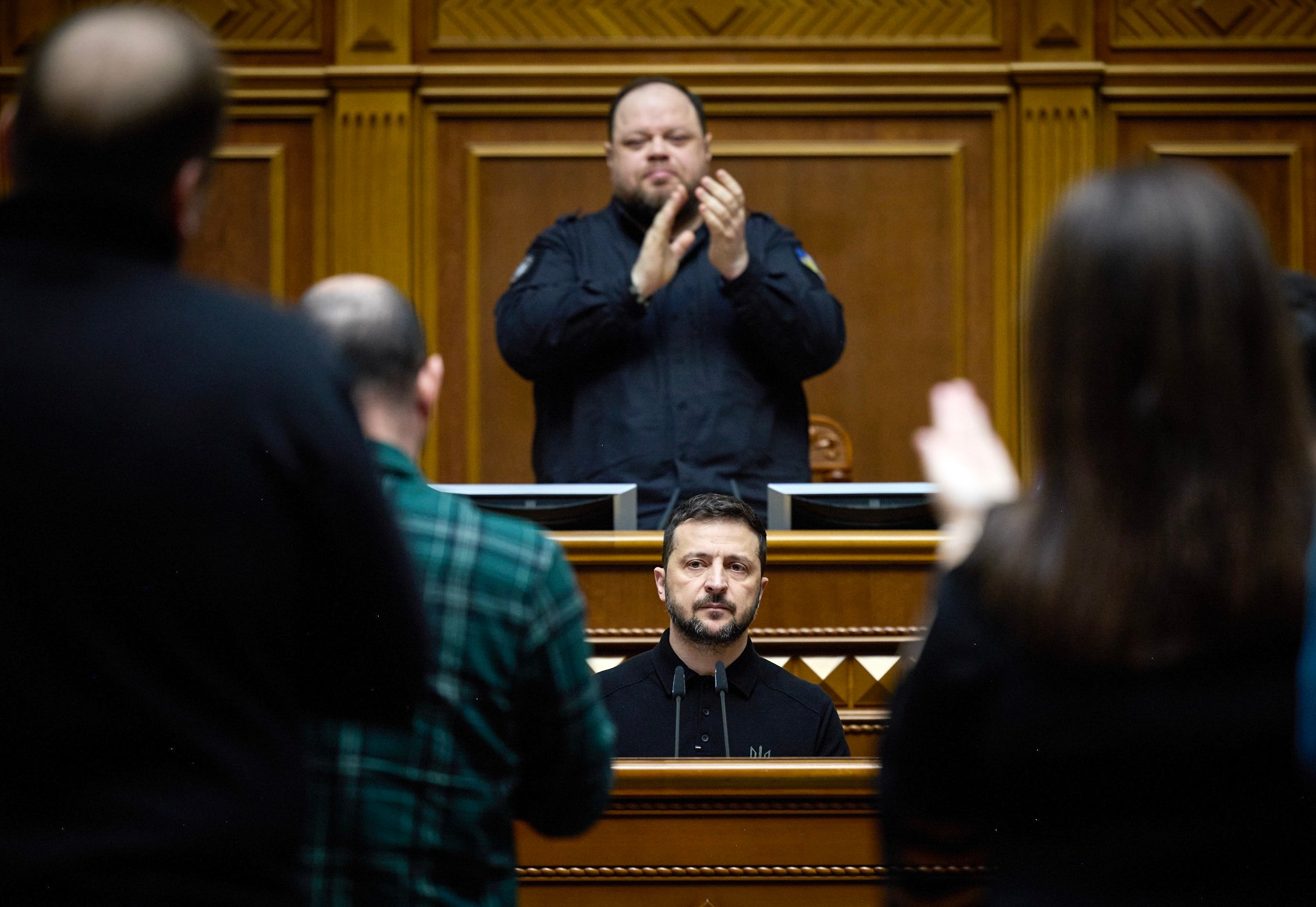 Ukrainian President Volodymyr Zelensky receives applause as he addresses lawmakers in the Ukrainian parliament. Photo: EPA-EFE