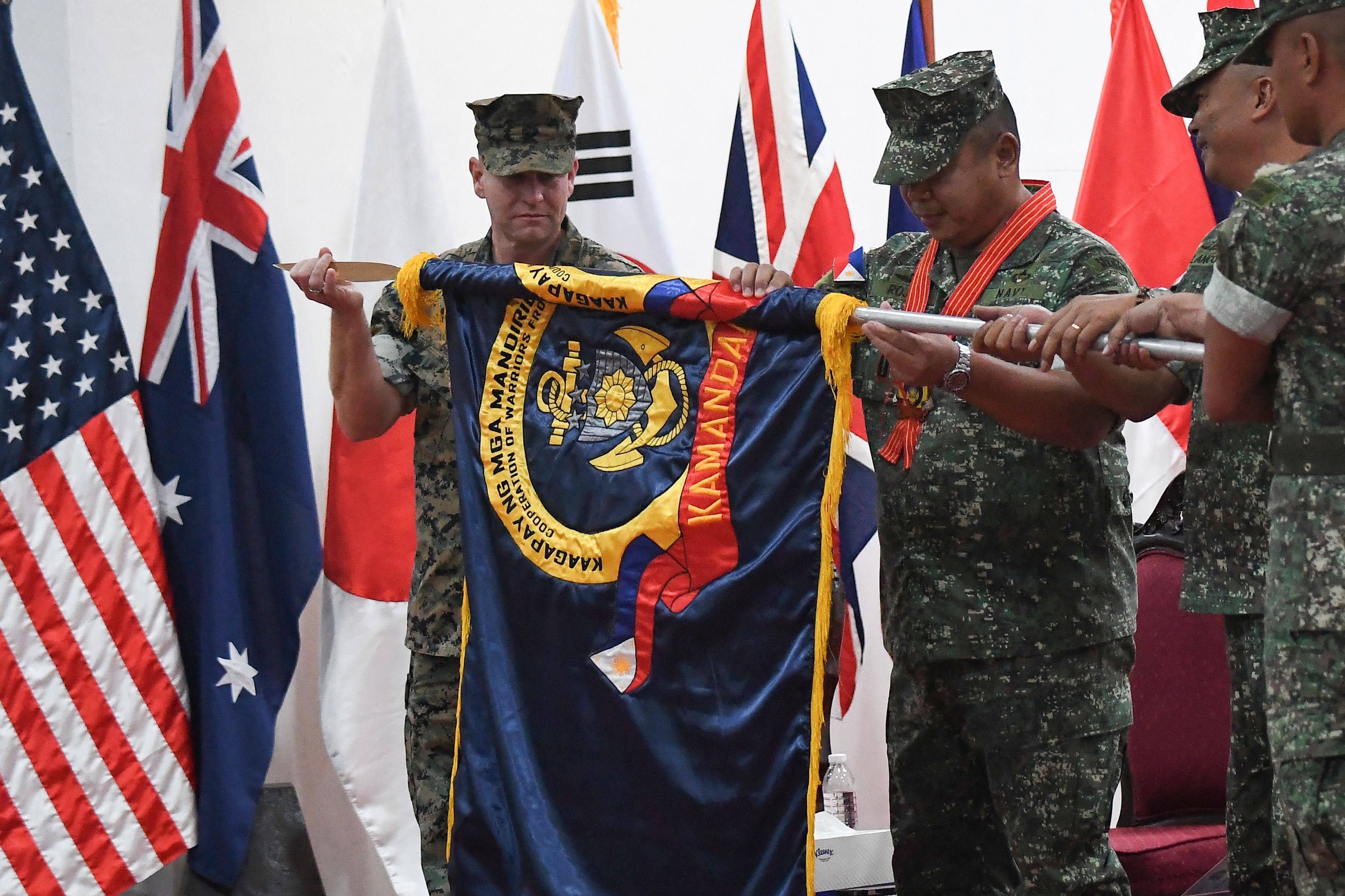 Top Philippine and US Marine officers take part in the opening ceremony of the Kamandag 2024 military exercise at Fort Bonifacio in Manila on Tuesday. Photo: AFP