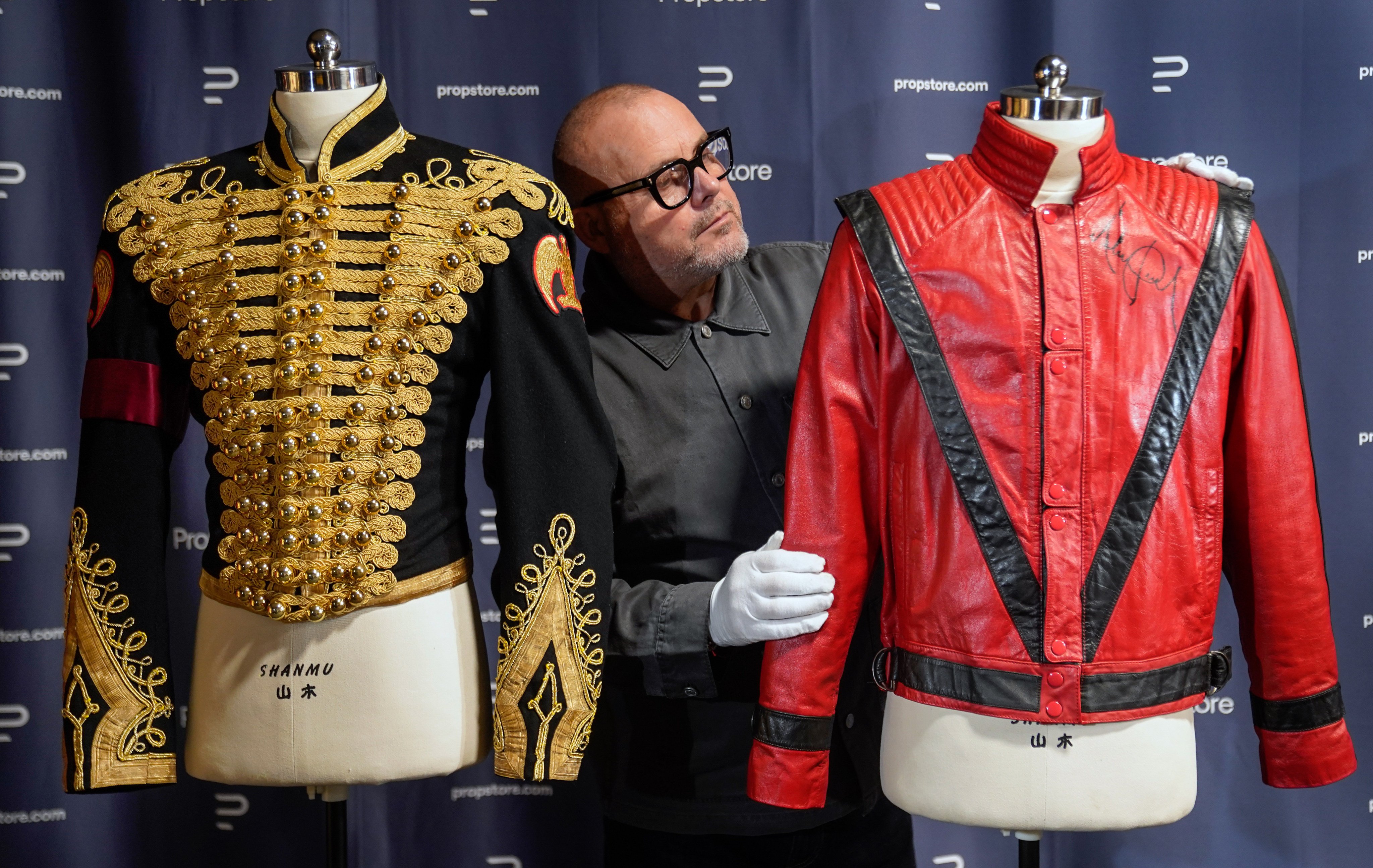 Michael Jackson’s autographed tour rehearsal Thriller jacket, and his black-and-gold military-style jacket are up for auction in the UK in November. Photo: DPA