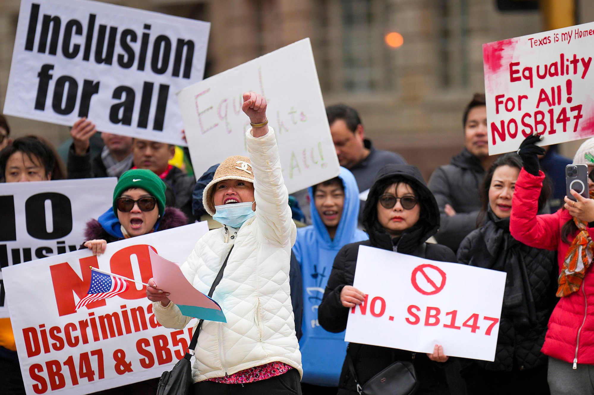 Protesters rally in Dallas in January 2023 to oppose a Texas Senate bill that would outlaw property ownership by people from China, Iran, North Korea and Russia. Photo: Dallas Morning News/Tribune News Service