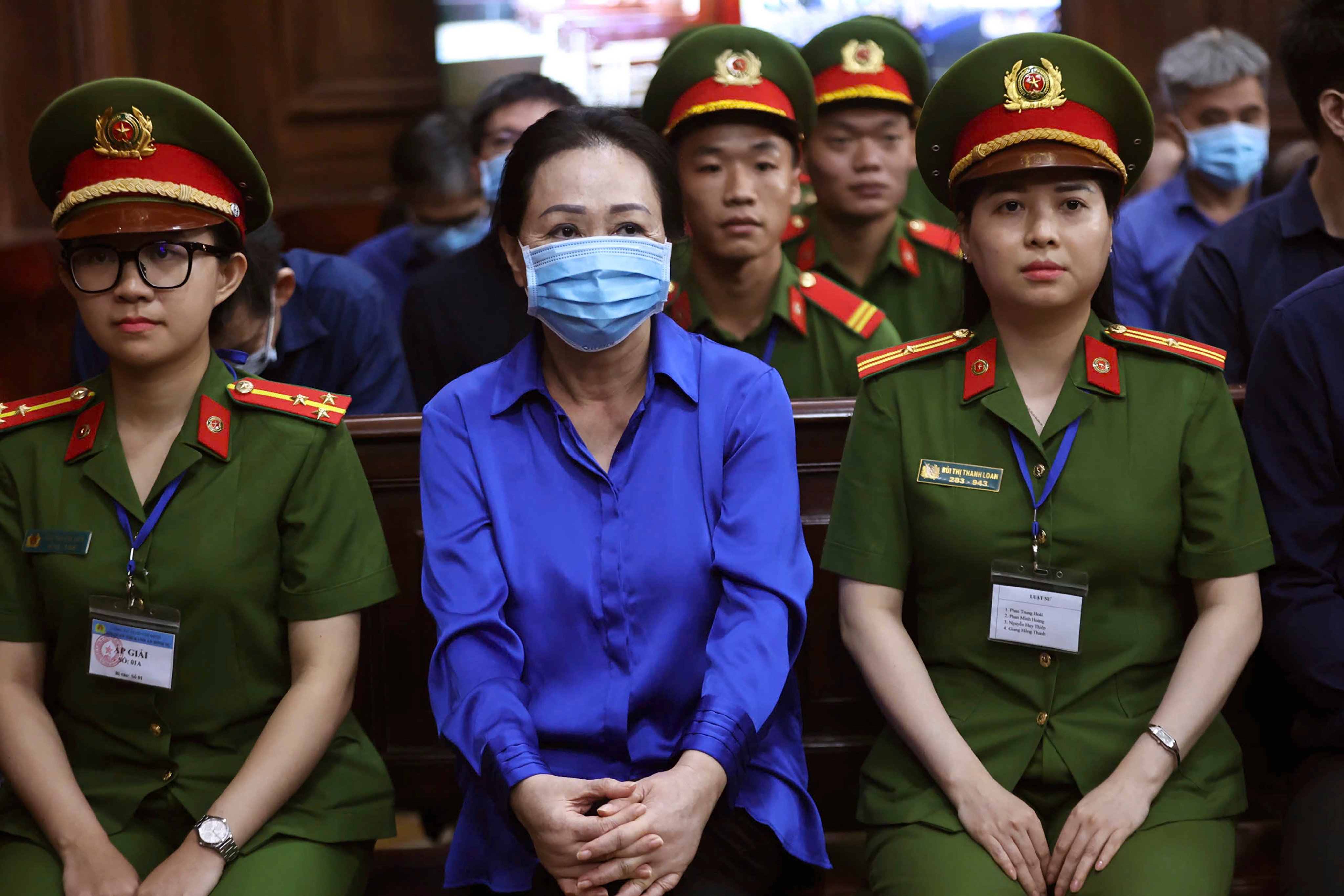 Vietnamese real estate tycoon Truong My Lan (middle) sits in court to wait for her verdict. She was already convicted in April by the same Ho Chi Minh City court of fraud amounting to US$12.5 billion. Photo: AP