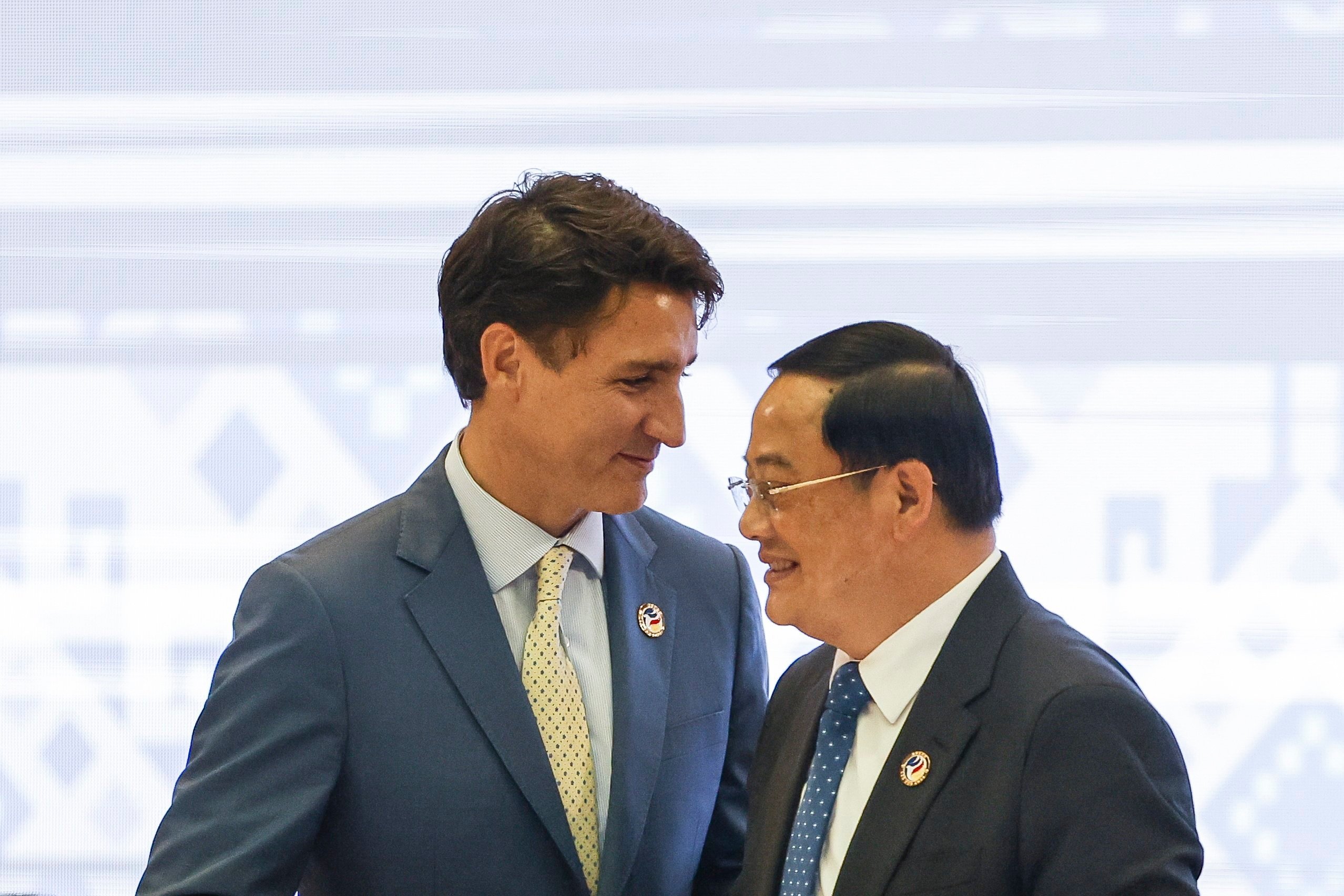 Canada’s Prime Minister Justin Trudeau greets Laos’ Prime Minister Sonexay Siphandone during the Asean-Canada Special Summit in Vientiane last Thursday. Photo: EPA-EFE