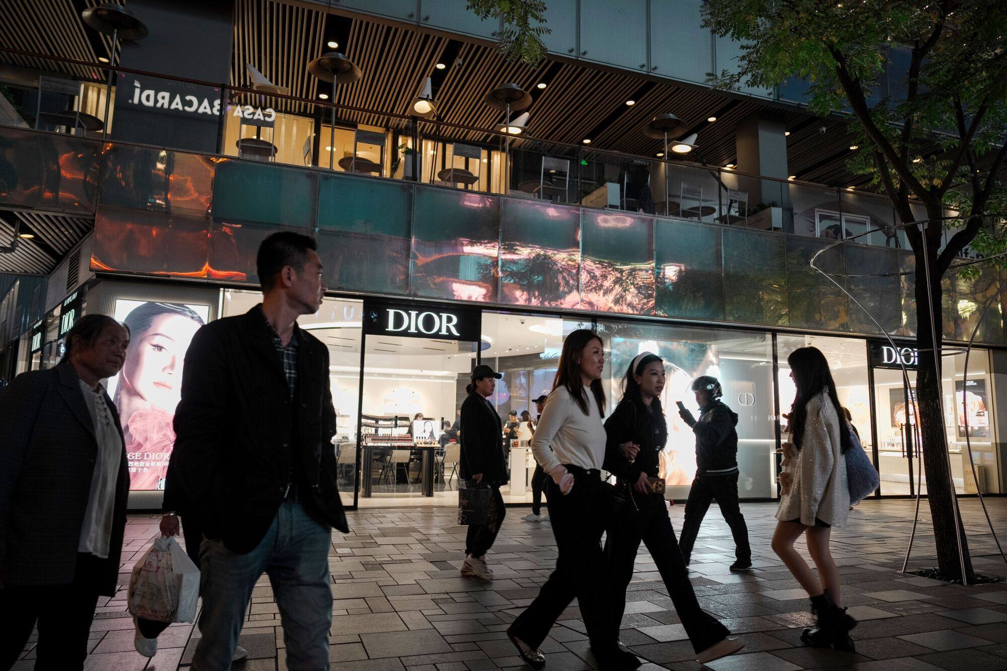 Consumers seen outside a Christian Dior store in Beijing in October 2024. Photo: Bloomberg