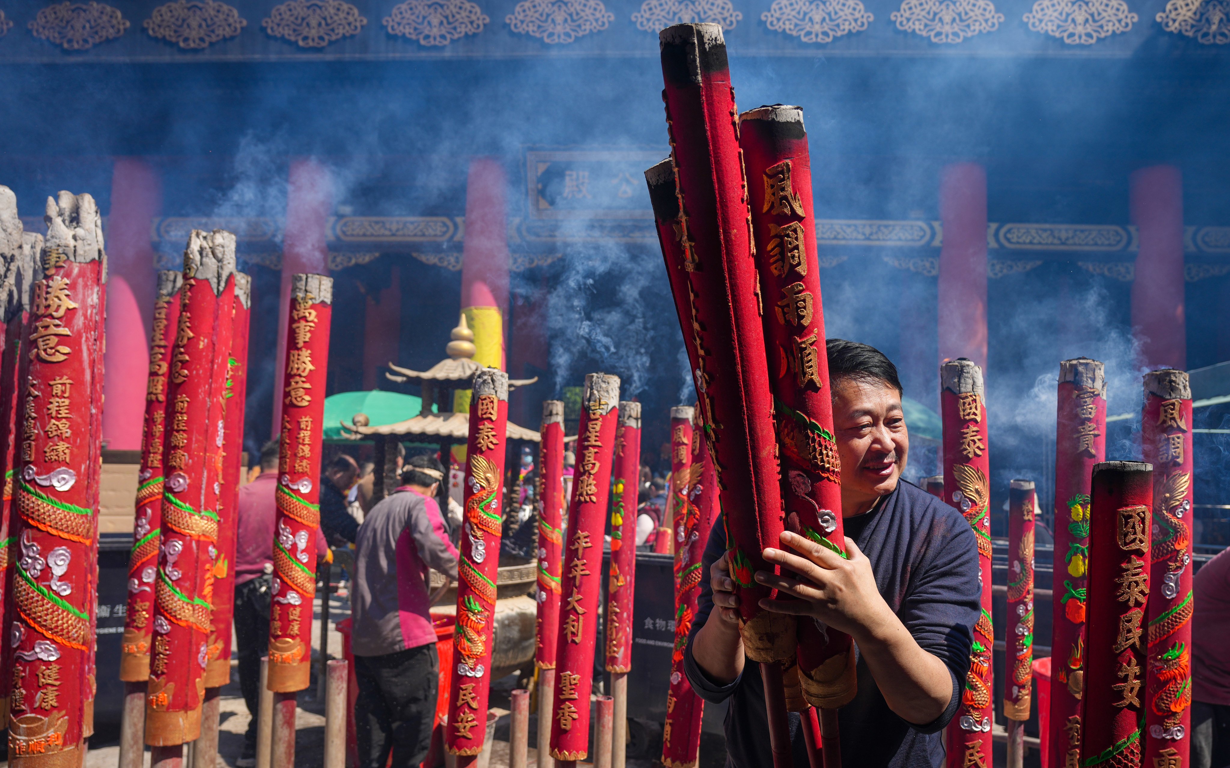 Worshippers burn incense sticks at Che Kung Temple, Sha Tin, one of the historic sites included in a guided tour offered this weekend in Hong Kong. It’s a way to stretch your legs. Photo: Eugene Lee